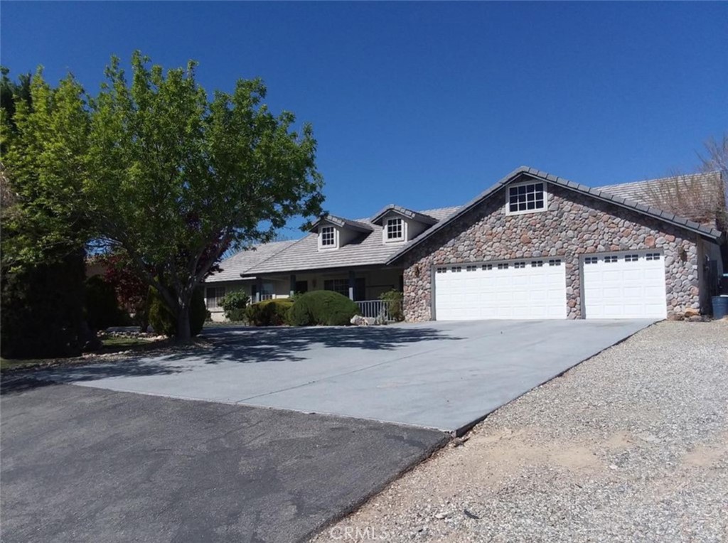 Welcome to this beautifully maintained 4-bedroom, 2-bathroom home nestled in the sought-after Desert Knolls community of Apple Valley. Spanning 2,396 sq. ft. on a generous 0.76-acre lot, this home perfectly balances comfort, space, and style — ideal for family living and entertaining.
From the moment you arrive, you’re greeted by lush front landscaping featuring mature trees and a manicured lawn, creating a warm and inviting curb appeal. A three-car garage, RV access, and drive-through driveway provide ample parking and storage. Step inside to find high ceilings and two living areas — a formal living room and a cozy family room complete with a fireplace and a formal dining area. The open-concept kitchen features a breakfast nook, breakfast bar, double oven, stovetop, dishwasher, pantry, coffee bar area, and plenty of cabinet space. The split floorplan ensures privacy and functionality. The primary suite is a spacious retreat, featuring a walk-in closet and an en-suite bathroom with a separate soaking tub, walk-in shower, and dual sinks. One of the additional bedrooms can easily serve as a bedroom or a home office, while the remaining two bedrooms are generously sized, each with walk-in closets. The second bathroom includes a shower/tub combo.The dedicated laundry room is thoughtfully designed with plenty of cabinetry, a deep utility sink, countertop space, and direct backyard access. Step outside to your private oasis! Enjoy the spacious covered patio, three storage sheds, and a newer in-ground pool with a secure safety fence with desert and mountain views. Whether you're entertaining guests or enjoying a quiet morning coffee, this backyard has it all. Additional features include solar panels for energy efficiency and cost savings. Located just minutes from Highway 18, this home offers convenient access to shopping centers, schools, parks, St. Marys hospital, and restaurants, making it a prime location for comfort and convenience. Don’t miss your chance to own this incredible pool home in one of Apple Valley’s most desirable neighborhoods. Schedule your private tour today!