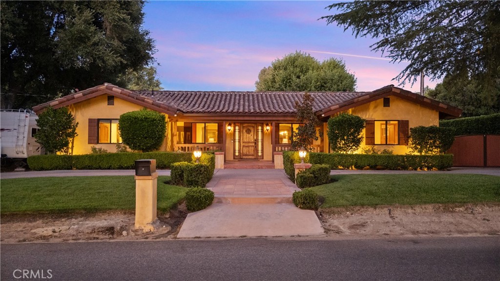 This beautiful custom single-story home in sought-after Happy Valley seamlessly blends modern upgrades with the charm of an established neighborhood. A one story home spanning over 3,000 SF, this expansive layout features 3 spacious bedrooms, each with its own en suite bath, plus a stylish guest powder room—all set on a generous 14,000+ SF lot. The kitchen is a true showstopper, featuring custom cabinetry, granite counters, a striking blue marble island, copper sinks, under-cabinet lighting, a convenient pot filler, top-tier Thermador & Viking appliances, a built-in coffee maker, cooling drawers, and more. The bathrooms are equally luxurious, showcasing beautiful stonework, upgraded fixtures, and elegant cabinetry. Retreat to the private primary suite, complete with French doors leading to the backyard and dual walk-in closets. Step outside to enjoy the large swim-spa under a covered gazebo, a tiled patio with a built-in sound system, stamped concrete, and an electric driveway gate with ample parking. There’s even RV parking with electric & sewer access and a 4-car detached garage with a versatile bonus room—perfect for an office, gym, or playroom. Designed for both comfort and style, this home boasts wood and stone floors, upgraded windows, newer clay tile roof, dual industrial HVAC units, two tankless water heaters, a security system with cameras, whole-house Nest & Ring systems, Polk audio, central vac, a whole-house fan, and more. Nestled in a peaceful yet convenient location with no Mello Roos or HOA, this home is truly one of a kind. Don’t miss your chance—come see it today!