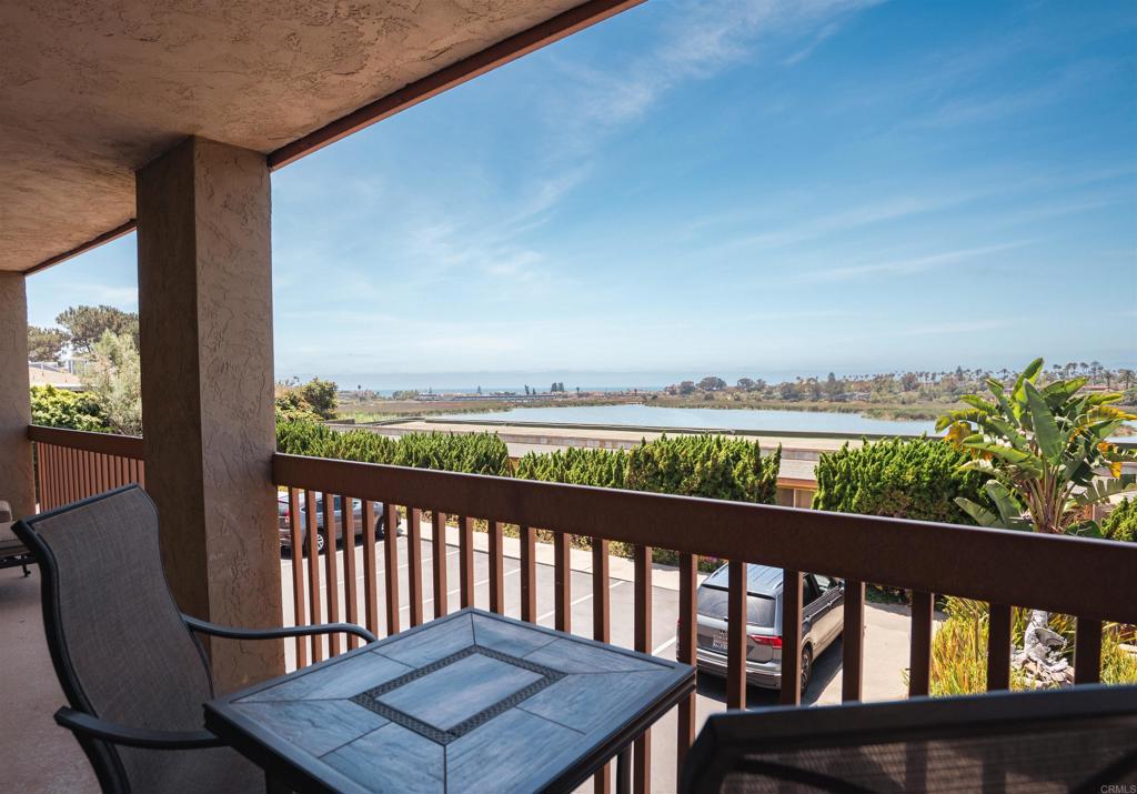 Spectacular View Of The Lagoon And Ocean From The Balcony and Inside The Home. Upgraded And Immaculate Turnkey Home With A Very Moderate Association Fee Of $400. Pool, Bike Storage, Bar B Que, Carport With Locking Storage, Open Parking Spot In Addition To The Carport Space. What A Fantastic Location Within Walking Distance To The Village With Restaurants, Shops And Entertainment. Beach Close As Well. Single Level Living That Is Stair Free. Upgrades Include Quartz Counters, Luxury Vinyl Plank Flooring, Remodeled Baths, Stack Washer And Dryer In A Closet. Less Than 2 Minutes To I-5 For easy Commuting.