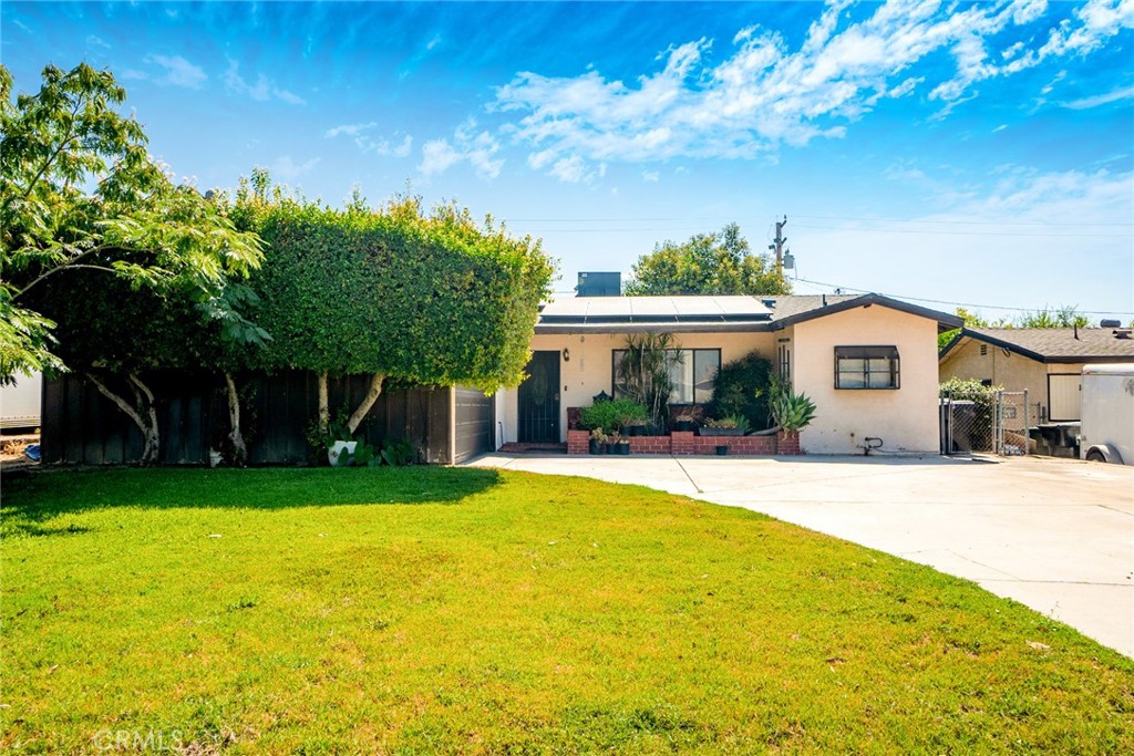 Great opportunity near Cal State San Bernardino! First time on the market since 2000! This single story 4 bedroom 2 bath home offers 1227 sq ft of potential on a spacious 7920 sq ft lot. Built in 1957, it's ready for a fresh start and some TLC. Perfect for first time home buyers or a handy person looking for a project. This home features a large backyard ideal for entertaining, a leased solar system through Sunova (Buyer to assume the lease), a 4 year old roof that was installed at the time the solar was installed, a two car garage, and is located on a charming tree lined street just minutes from Cal State San Bernardino. Don't miss this chance to bring your vision to life!