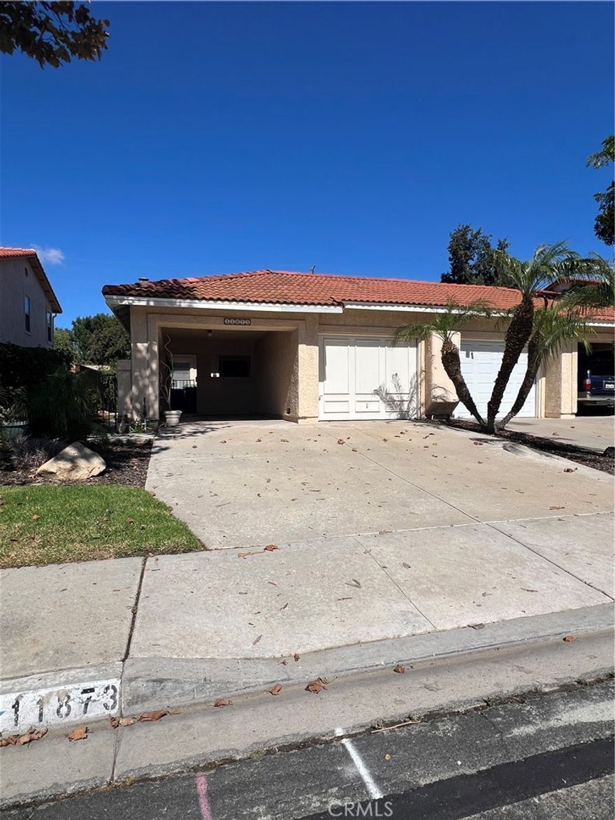 Single Story Single Family Home with one common wall. Private Backyard. 1 Car Garage with new door and opener plus a carport and room to park 2 more cars in driveway. Freshly painted. New ble Carpeting.Vaulted Ceilings in Living Room and Master Bedroom. Master Bedroom with own full bath plus 2 closets.New Windows and Slider. Breakfast Bar. Includes Washer/Dryer, Refrigerator, Gas Oven/Range. Private backyard with artificial turf. 2nd bedroom has its own full bathroom. Lots of natural light. small pet will be considered - $100 extra per month