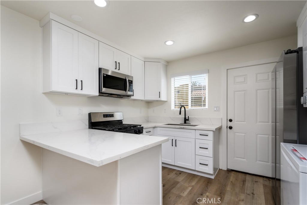 Now available for lease is this brand-new, 740-square-foot 1-bedroom, 1.5-bath home built in 2023, located in the vibrant city of South Gate, CA. This two-story residence features a modern, functional layout with an open-concept kitchen, living area, and a convenient half bath on the first floor. Upstairs offers a spacious bedroom with a full bathroom, large closet, and plenty of natural light. Designed with comfort and efficiency in mind, the home includes dual-pane windows and an energy-efficient mini-split system for heating and cooling. The kitchen comes fully equipped with a refrigerator, microwave, and range/oven, while a stackable washer and dryer add convenience to the in-unit laundry area. Located in the heart of Southeast Los Angeles County, South Gate provides easy access to major freeways, shopping, schools, and parks—making it an ideal rental for those seeking a clean, modern home in a well-connected location.
