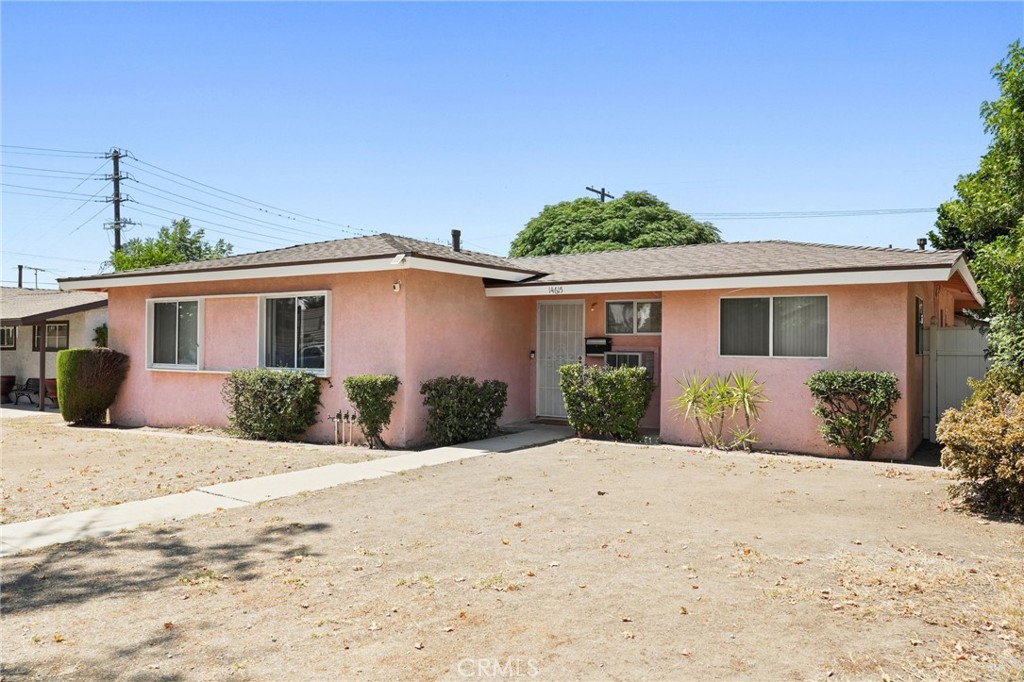 Back on the Market – No Fault of the Seller! This beautifully maintained home has been in the same hands for over 70 years, showing a clear pride of ownership throughout. With four bedrooms and two bathrooms, it’s completely move-in ready. Selected areas—including the kitchen, primary bedroom, living room, and the outdoor carport and trim—have been freshly painted, giving the home a bright, updated feel while maintaining its character. The roof is brand new, providing peace of mind for years to come. The spacious den includes a classic wood-burning fireplace that adds warmth and character—great for quiet evenings or hosting guests. The primary bedroom features its own bathroom and connects to an adjoining bedroom, ideal for a home office, creative space, private lounge, or nursery! On the opposite side of the house, a hallway with built-in storage leads to two additional bedrooms and a full bathroom—offering separation and flexibility for a variety of living arrangements. At the back of the home, a large screened-in bonus room provides extra living space and houses the laundry area. Whether used as a game room, studio, workshop, or relaxation space, it adds year-round usability. The backyard is designed for low-maintenance outdoor living, with a gated alley entrance, covered carport, and space for up to three vehicles. A built-in storage cupboard and mature shade tree create a peaceful setting that’s equally suited for entertaining or unwinding. Situated on a generous 7,442 sq ft lot, the home is conveniently located near parks, shopping, dining, and with easy access to the I-5. This is a rare opportunity in San Fernando—comfortable, well cared for, and ready to enjoy from day one.