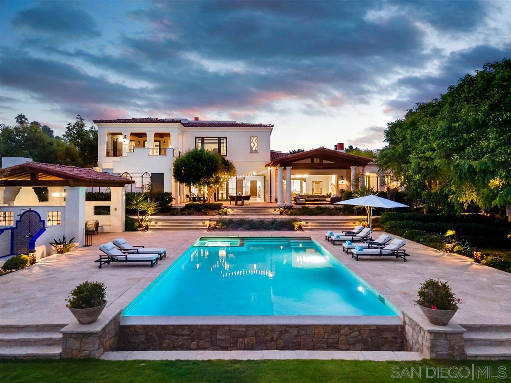 Jaw dropping resort style grounds, sprawling on almost 1 ACRE of usable space.Stunning views to the south from deck,Dual master suites w/1 on entry level.As private as it gets & completely gated.Soaring ceilings,tons of light, private gardens, open concept kitchen/family room to yard.Exceptional in design & functionality this Leed Silver Certified home has all the bells & whistles,Smart Home/Audio/visual system & photo-voltaic panels.Every inch has been thought through,See Supp Remarks BELOW. Private gated entry and circular courtyard w/custom tiled fountain. Gourmet kitchen, vacuum system, energy efficient, laundry room, custom closets, custom everything! Home is ready for LULA elevator. Smart Home System, LED lighting, A/V System, LEED Silver Certified with photovoltaic Panels, Steam Showers, All rooms prewired for access for centralized A/V sources to include wiring for Dish,Direct TV,Blu-Ray. Roof Deck w/Views of the south. Oversized 3 car garage bay w/ separate 1 car garage both w/direct access to home. Beautiful woodwork and covered terraces, resort like grounds, solar heated pool w/auto pool cover. CAT 6 wired, whole house security ready. Equipment: Dryer,Garage Door Opener,Pool/Spa/Equipment, Range/Oven, Washer Other Fees: 0 Sewer: Sewer Connected Topography: LL