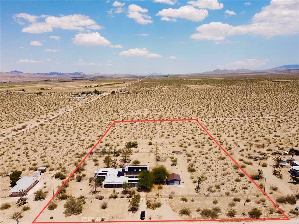 Welcome to your private desert retreat in Lucerne Valley! This expansive 5-bedroom, 3-bathroom home offers over 3,200 square feet of living space and an attached 2-CAR GARAGE — the house has room for improvement, so make it your own! Situated on a flat 5-ACRE lot with dual street access from both the front and back of the property, this home provides endless potential for expansion, additional dwellings, animals, or outdoor recreation. It also features a 400 AMP UPGRADED ELECTRICAL PANEL and an upgraded ELECTRIC WATER HEATER for improved efficiency and modern energy demands.
Recent updates include interior paint, a NEWER ROOF (completed in 2022, $50K value add), and a large SOLAR SYSTEM producing approximately 47,531 kWh per year — a tremendous energy savings opportunity. The solar is on a lease, and the buyer must qualify to assume the agreement. Monthly credit from Socal Edison may be available to offset solar lease costs! The property is fully fenced for added privacy and features an ADDITIONAL DETACHED GARAGE with ELECTRICITY for extra storage, ADU, workshop use, or additional vehicles.
Whether you're looking to create a multi-home compound, bring your animals, or simply enjoy the space and quiet, this property offers unmatched flexibility and value.