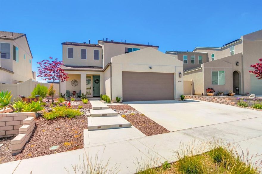 BETTER THAN NEW WITH A PANORAMIC VIEW!!! This nearly new home is SO ready for you to move in! Enjoy the sleek, modern design (including fully paid solar) without worrying about the cost of landscaping or window coverings. Just 2 years old, 35140 Bergamot Cove is one of the most desirable lots in the community with an incredible view from the backyard and even better from the primary suite balcony. It comes complete with gorgeous low-water and low-maintenance landscaping that you can be proud of, when friends and neighbors stop by to say hello. The upgraded kitchen provides ample counter space over expansive wood-tone cabinets and includes a walk-in pantry and 4-seat bar height counter kitchen island. The first-floor bedroom is perfect for your out-of-town guests with a full 3-piece bath just steps away. Features that make this home THE ONE: Bright, sun-filled great room layout offers exceptional connection between family chef and party goers; Separation between primary and secondary bedrooms; Smart Home centralized hub to control lights, temperature and more (or connect your mobile device for control); nicely appointed laundry with cabinets and deep sink; covered patio to enjoy the cool evening breeze enjoyed by this elevated location. Citro community amenities include: “The SPOT” complete with pool and spa, covered outdoor dining and BBQ area, shaded sensory garden, and spacious artificial grass gathering space; Willow Grove Park complete with Sandlot baseball diamond and attached shaded playgrounds; private “Citro Garden;” bocce ball court; dog park; and 14 miles of walking and hiking trails throughout the community with easy access to the Monserate Mountain Preserve trail system.