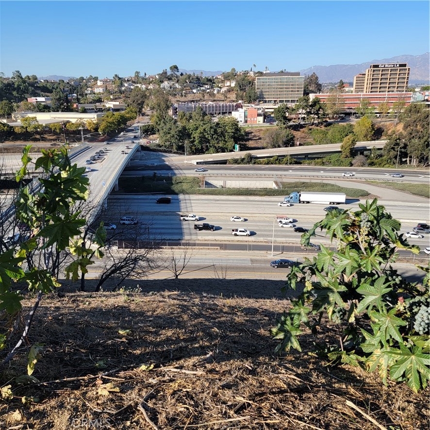builders and developers in City Terrace, Los Angeles County! This 4,584 sqft lot, zoned LCR1, offers a panoramic view of Cal State University L.A., and is minutes from Downtown LA, LAC+USC Medical Center, and the freeway crossing (10, 710). Neighboring land (APN 5225-002-038) is also for sale. The sewer line is available on the button side, with rear access, like an alley, all utilities on the street, and existing homes across the street. The buyer is to verify all details and conduct their due diligence. Borderline with Monterey Park and El Sereno.