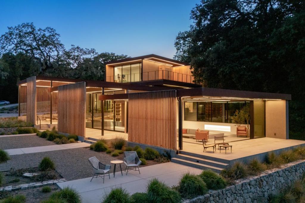Discover a Contemporary Masterpiece at the Santa Lucia Preserve designed by Mark English Architects in 2020. The Meadow House stands as a testament to harmonizing modern luxury with the untamed natural beauty of The Preserve. Wrapped around an ancient oak grove in a Z configuration, the design preserves and honors the expanding meadow in the view. Expansive openings and massive retracting doors with deep verandas graciously merge indoor and outdoor living. The exterior palette of weathered steel and cedar battened screens soften the boldness of modern design in a wild setting, blending into the surrounding environs. The expertly appointed chefs kitchen with shoji sliding screens inspires entertaining on a grand scale while guests enjoy six ensuite bedrooms, two half baths and an additional full bath, a lower-level media room, a special yoga/meditation retreat and a separate guest house. The inspired living pavilion offers an intimate library and a sunken lounge for gathering amidst the mesmerizing views. The ultimate luxury of the Meadow House is the location in the heart of The Preserve community; live in nature and walk to dining at The Hacienda, Sports and Equestrian Centers or travel the abundant trails. A perfect balance of nature and lifestyle for the adventurous at heart.