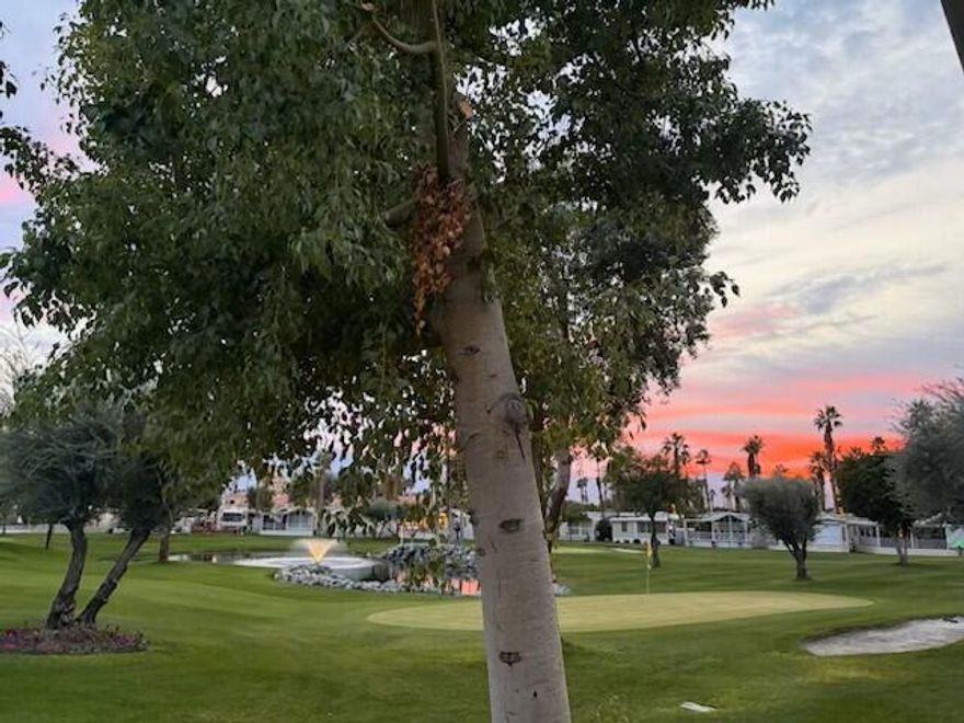 This Park Model, located on the 13th Green has Views, Views and more Views, of the mountains, water feature, 3 golf holes.  It offers auto shutters, turnkey, tile covered deck, great living space inside and outdoors. Tile floors through-out. It offers a Microwave/Convection oven, Pull out shelves in the kitchen and also extra storage in bedroom and also under the bed. Sat 'C' pool/spa across from the front door along with W/D.\, and mailboxes. Sit out on the deck and view gorgeous Sunsets. Don't miss this one on the golf course.