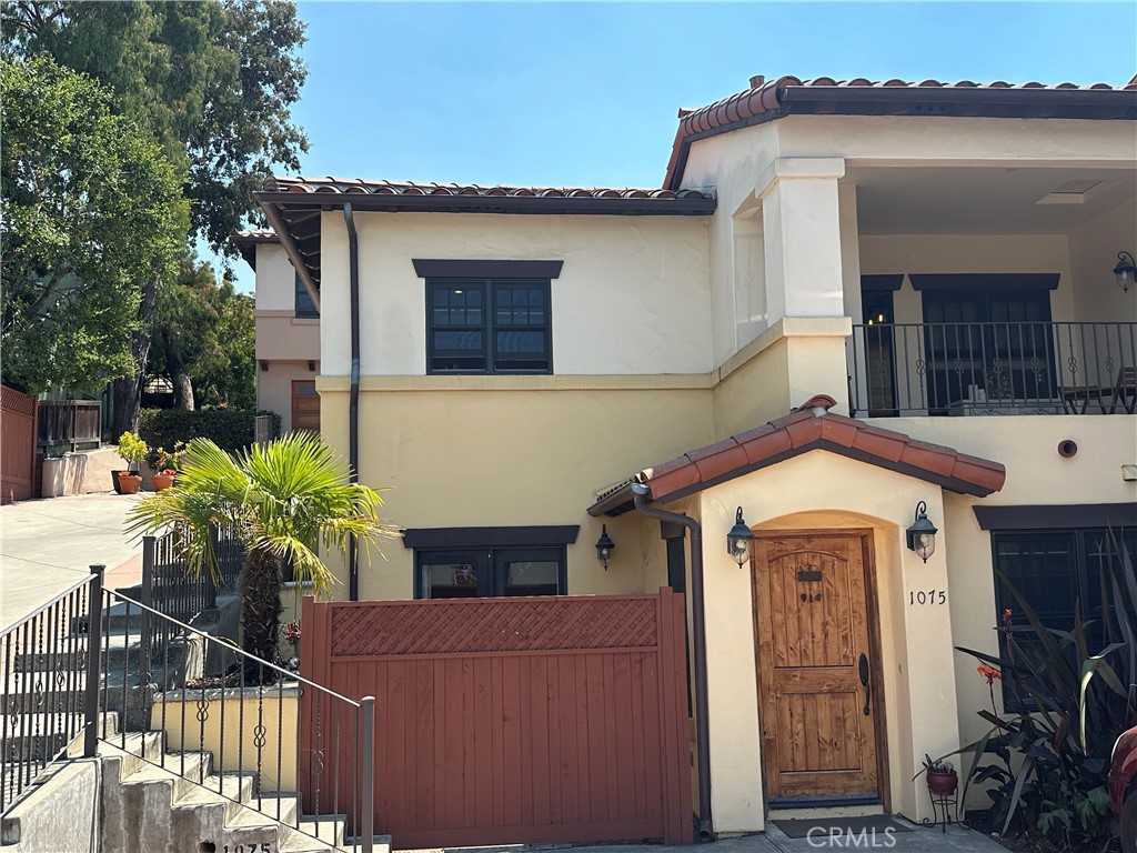 1075 Ella Street is part of the City of San Luis Obispo’s Moderate Income Housing Program. Located in the desirable Terrace Vista community, this beautifully designed home offers a unique layout with entry on the first floor. The living room, bedroom, bathroom, and laundry closet are all conveniently located downstairs, while the upper level features a bright, open kitchen and dining area with cherry cabinetry, granite counters, and stainless steel appliances, including a Viking refrigerator. Just off the dining area is a large, covered terrace, perfect for soaking in the gorgeous panoramic views of the city and surrounding peaks and hills. Additional outdoor space includes a separate fenced patio off the bedroom. The home includes one designated parking space and a storage closet adjacent to the entrance. Enjoy proximity to the Jennifer Street Bridge, which connects to the San Luis Obispo Rail Trail for easy bike and pedestrian access to downtown. Nestled beside Terrace Hill, the neighborhood offers scenic beauty and access to the Terrace Loop Trail and a shared community patio.