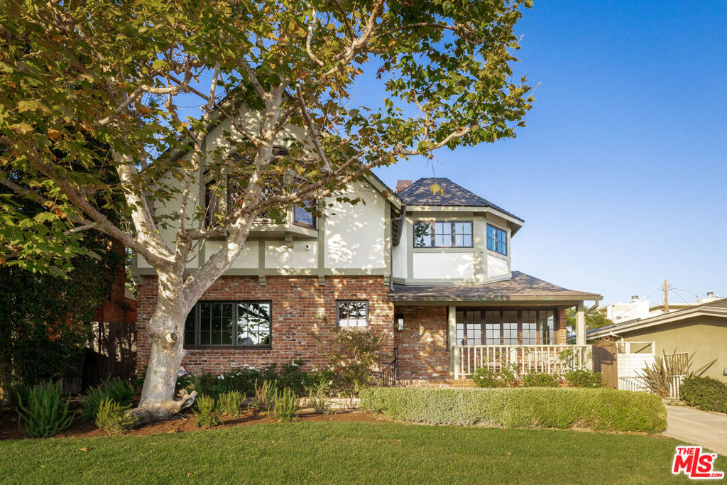 On one of Mar Vista's most coveted streets, with views to the ocean and Marina del Rey, this classic Tudor has been beautifully reimagined to honor its heritage while showcasing exceptional design, detail, and craftsmanship. The result is a home that retains the romance of its English cottage roots while living with ease and sophistication. The 4 bedroom home, complete with fully permitted ADU and pool, highlights newly refinished solid oak hardwood floors and original leaded-glass windows that speak to the home's history, while subtle refinements and custom modern upgrades bring a sense of balance, comfort, and livability. At the heart of the home, the kitchen is designed for both beauty and function, with custom cabinetry and Pietra Artica stone surfaces that create a timeless setting for daily living and entertaining. Bathrooms throughout echo this sensibility, with artisan tile, refined fixtures, and craftsmanship that merge old-world charm with modern design. Outdoors, the property transforms into a private retreat. A sparkling pool anchors the backyard, framed by lush greenery and new fencing. A permitted covered patio, built-in BBQ, and poolside bar extend the living space outdoors, creating the perfect backdrop for gatherings that flow seamlessly from day into evening. With all-new internal systems and a new roof, this is more than a renovation it is a complete reimagining, creating a lifestyle of beauty, comfort, and lasting value in the heart of Mar Vista. With close proximity to The Beethoven Market, Mar Vista Farmers Market, Blueys, and so much more!