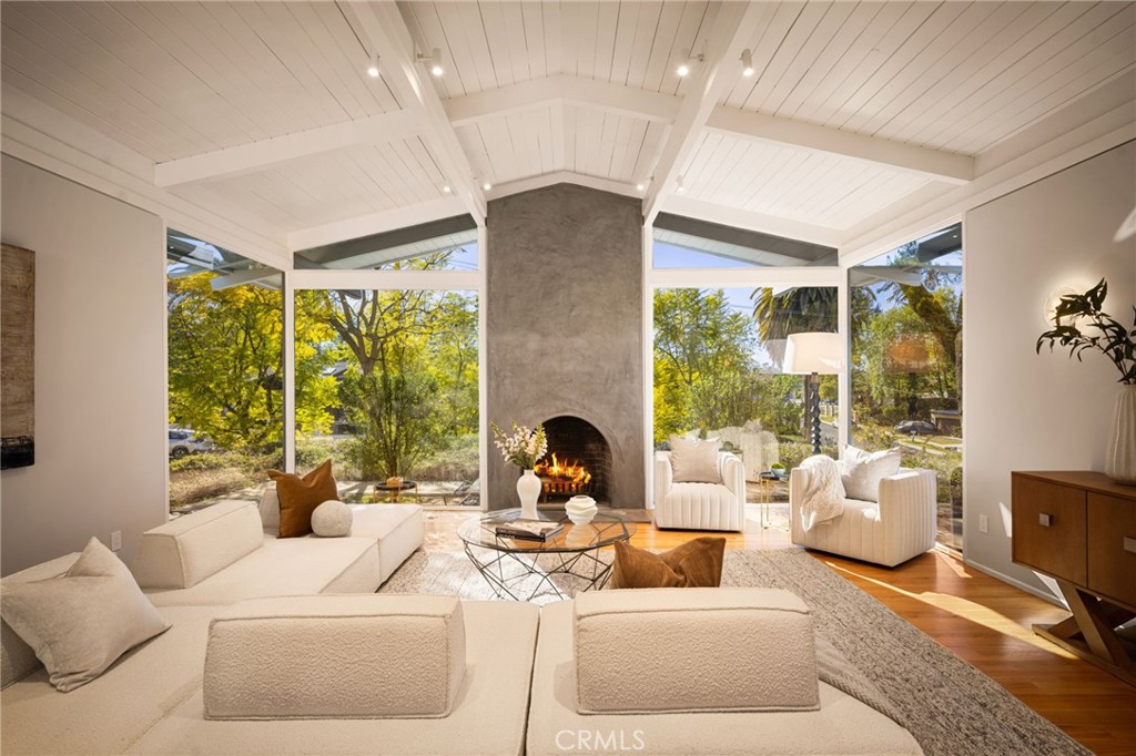 Welcome to 4750 Poe Avenue, a stunning mid-century modern masterpiece nestled in the prestigious Vista de Oro neighborhood of Woodland Hills. Designed by the acclaimed architect Louis M. Naidorf, celebrated for his work on Hollywood's iconic Capitol Records Building, this home was thoughtfully crafted as his personal residence. This architectural gem offers four bedrooms, four fully remodeled bathrooms, an office, and a den within its expansive 3,287 square feet. The home boasts exquisite custom white oak cabinetry and premium finishes that complement its modern aesthetic. Refinished floors throughout the residence add to its warm and inviting ambiance. The exterior is equally impressive, featuring a newly refinished pool with brand-new concrete surroundings, fresh landscaping, and a seamless indoor-outdoor flow. The smooth stucco finish enhances its timeless mid-century appeal.
Experience the visionary design and enduring elegance of this mid-century modern icon.