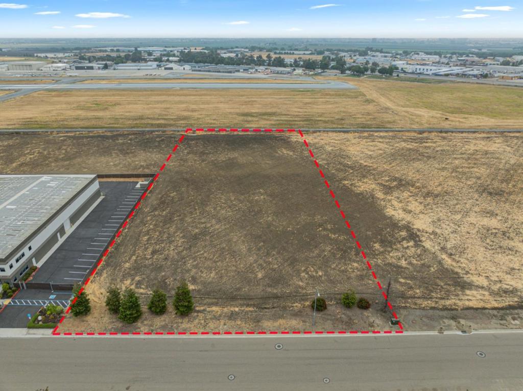 "Why drive when you can fly?" Is what you will be asking yourself once you own this 2.78-acre lot at Hollister's premiere Air Park Business Center. Located adjacent to the Hollister Municipal Airport (KCVH) it is one of the few parcels available that is "Airport Taxi Accessible". Also known as "through the fence runway access". So, whether you are looking for a location to house your corporate aircraft, private hanger, or to develop an airport use to compliment the first two, this location should be a strong consideration. Zoning is "M1" (light industrial) with Airport Support (AS) overlay. Improvements and utilities are present and stubbed to the parcel (street, curb, gutter, sewer, water, power, phone and storm drain). Close proximity to Highways 25, 156, 152, 101, and 5 make this geographically desirable for when you do have to drive. Hollister's Municipal Airport offers two runways with the main runway being 6350 feet long with an additional 1150' of displacement threshold to accommodate larger business aircraft and also having full service FBO support and fuel services. Join the ranks of these other industry giants who are close by like Amazon, Teknova, West Marine, and Marich Confectioners to name a few.