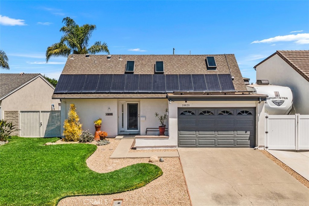 Look no further! Welcome to this beautifully appointed 5 bedroom residence that spans 2334 square feet nestled in the interior of sought-after Century Park neighborhood in South Fountain Valley just steps to Cordata Park with thoughtfully updated modern comforts & eco-friendly upgrades...including paid solar panels, tankless water heater, dual pane windows throughout, central air conditioning, newer electrical panel, water softener & water filtration system. This home boasts a bright and inviting atmosphere! Spacious ground floor primary bedroom suite with slider to side patio, two closets & lovely primary bathroom with tiled shower featuring decorative tile accents, custom wood vanity stone countertop, built-in display niche, Retreat to the bonus room upstairs or a second primary bedroom with huge mirrored walk-in closet, & skylight or an entertainment area for the kids plus 3 additional bedrooms & an attractive remodeled full bath & remodeled separate half bath. Dramatic soaring ceiling entry with dual skylights & Pergo wood flooring throughout plus tile floors in the bathrooms, newer hardware, ceiling fans, smooth ceilings, silhouette shades, newer interior & exterior paint, expansive gourmet kitchen offers custom white cabinetry, ceramic tile floor, recessed lights & abundance of counter space. Step outside to your private backyard with sparkling pool & spa for ultimate relaxation plus enormous patio for barbeques & special occasions & dedicated side yard enclosure with RV potential & RV gate. Sun drenched living room with slider to patio alcove, ideal for enjoying morning coffee or an afternoon cocktail, flows seamlessly into expansive formal dining area. The highly desired family room has abundant windows & open beam ceiling with gas fireplace. 2 car finished garage with direct access to home in addition to 2 car driveway. Steps to neighborhood park with a wonderful playground, a short drive to pristine beaches plus freeway, shopping & dining close by! Located in a top rated school district: Courreges Elementary School, Fulton Middle School & Fountain Valley High School! Southern California living at it's best with daily ocean breezes & climate that's the envy of the world makes it a prime location near the border of Huntington Beach! Close to destination attractions like Disneyland, Knotts Berry Farm, Palm Springs, Catalina, San Diego & Santa Barbara for weekend getaways!