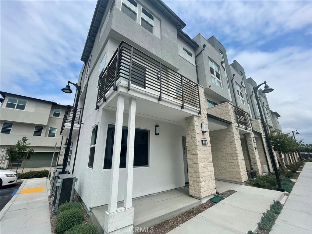 Built in 2022. This unit is ready for move-in. The unit has been well-optioned with premium interior finishes, and has an attached 2-car garage. Hardwood flooring, walk in closets, AC/heater, microwave, dishwasher, stove ,fridge, washer & dryer included. Located in central Anaheim, platinum triangle, with close proximity to Anaheim Garden Walk, Old Towne Orange Plaza, Disneyland, The Honda Center, and Angel Stadium. Easy access to major freeways. enjoy the walkability and short car trips to upscale shopping, dining and entertainment. Short commute to Chapman University, University of California Irvine, and California State University, Fullerton. Minutes away from Huntington Beach. Amenities include a pool, spa, two dog parks, BBQ areas, recreational grass areas, and walk-able paseos throughout.