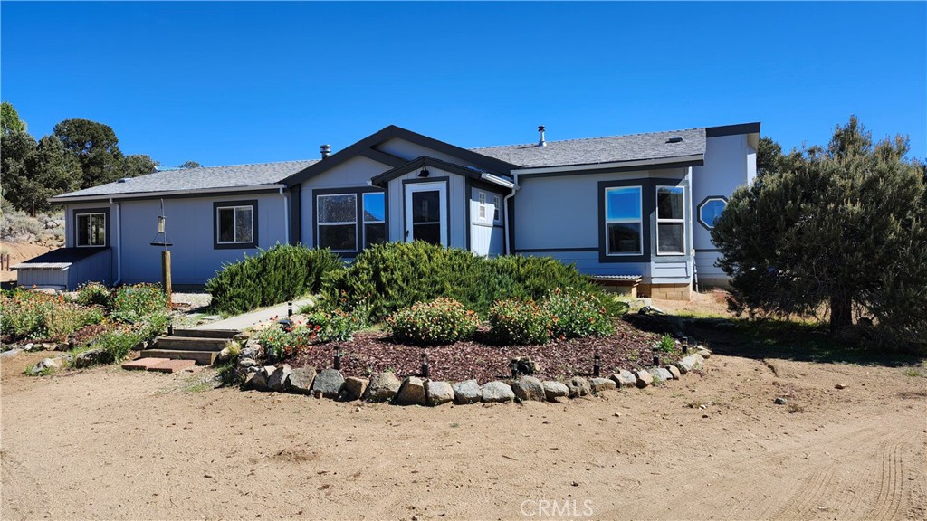 Beautiful family home in Kennedy Meadows with breathtaking views. Enjoy the ultimate off-grid lifestyle in this stunning 3-bedroom, 2-bath home in a scenic Sierra Nevada mountain community. Conveniently located just off the main paved road, this 4.57 acre all usable, fenced and gated property offers easy access all year round. Large primary bedroom features a walk-in closet and private bath with shower and garden tub. 2 more bedrooms, large kitchen, large living room, bonus room, and hall bath provide space for family and friends. Large view windows filled with natural light throughout, perfect for your indoor plants and gardens. Laundry room with utility sink just off the kitchen. Mudroom to store your boots and jackets. Furniture is negotiable. Off-grid energy independence: private well, solar power system installed in 2017 (new battery bank in 2023), and backup home generator. Cozy pellet stove and central heat. Fully fenced backyard with large carport provides shade for grilling and relaxing while your dogs play. In front, a walled carport the size of a 2 car garage provides storage for outdoor toys and one vehicle. Detached workshop equipped with electricity and workbench. Property to be sold as is. Plenty of room to grow, flowers and gardens. Property has Pinon Pines, Jeffery Pines and lots of room for toys, animals, horses and just what your dreams are. Kennedy Meadows is an outdoor enthusiast's dream: hiking on the nearby Pacific Crest Trail (PCT), fishing, horseback riding, ATV trails and hunting on nearby public land.