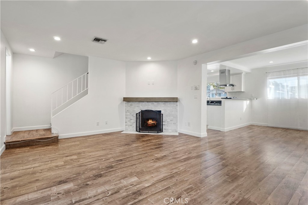 Gated, renovated townhouse with 3 bedroom, 2.5 bath in desirable Tarzana neighborhood only minutes to the the 101 freeway and Ventura Blvd with stores and restaurants. This is a corner unit that only shares one common wall and also includes a private patio. Unit has central AC , laminated flooring throughout, recessed lighting and a fireplace. There are stainless steel appliances, dishwasher, refrigerator and gas stove. All 3 bedrooms are upstairs. You can enter through an attached 2 car garage. Also includes bonus room with washer/dryer that could be an office or an exercise room as well. Gated area has a pool, spa and a tennis court.