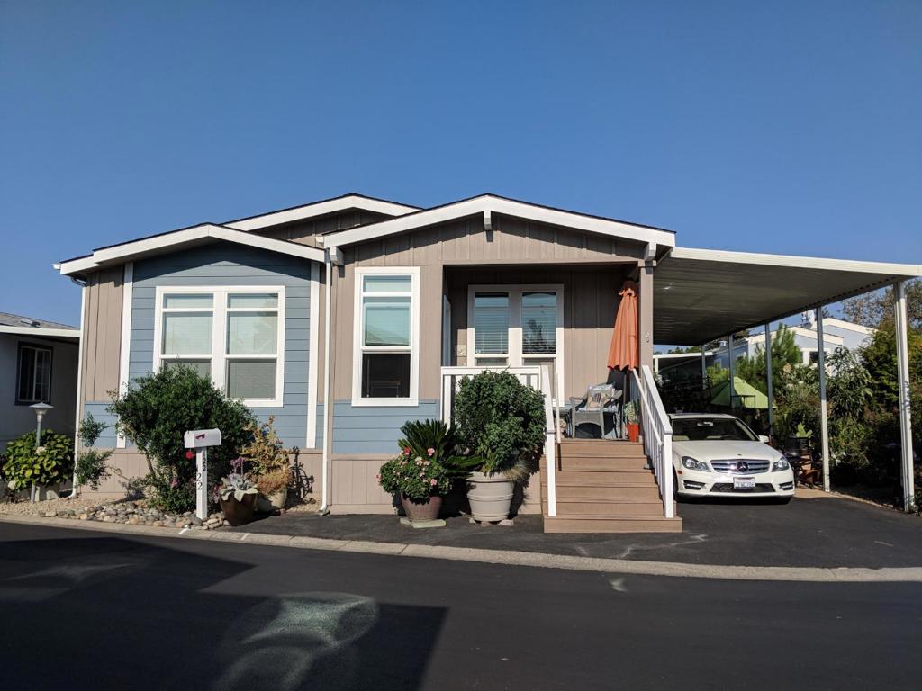 Location, location, location! Fantastic 3 bedroom, two bath home centrally located in New Frontier 55+ community - one of Mountain View's prestigious senior communities. Gentle bay breezes provide cool fresh living in this community of luxury manufactured homes. This home features a large lot, a large patio, front porch & matching storage shed. Gorgeous open concept. High ceilings with crown molding and generous woodwork accents frame the lovely gas fireplace. Wall-mounted TV connections are located under the mirror above the fireplace. The open concept kitchen features exceptional granite counter-tops and ample wooden birch cabinets. A frosted glass door leads to a full-sized pantry and stainless appliances, complete with a gas range, provides a kitchen any chef would love! The master suite features a large bedroom with an incredible master bath with double sinks, granite counter tops, a walk-in shower, garden tub and walk in closet with built-ins! This beautiful home won't last long!