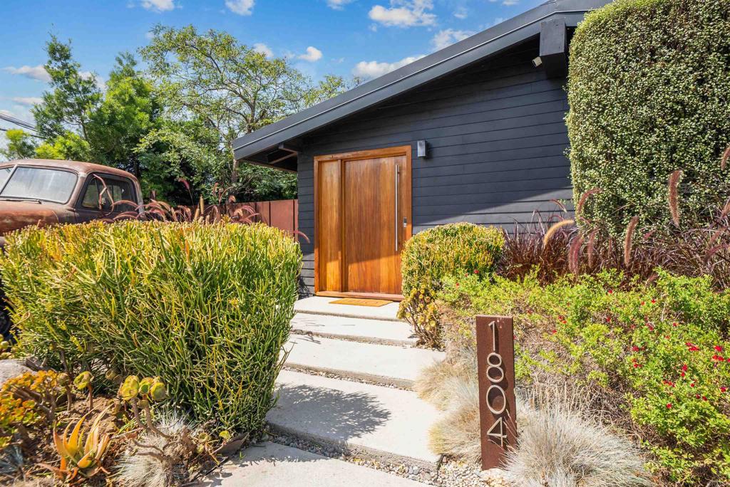 Welcome to this modern, sprawling gem of a property at 1804 Colonial Avenue in sunny San Diego! This 4-bedroom, 1.5-bathroom home is perfect for a family or as your next investment, offering a blend of modern convenience and classic charm. The main home spans 1,432 square feet (but feels larger), and has an open kitchen with stainless steel appliances, granite countertops, and a breakfast bar. Enjoy the inviting living area complete with hardwood floors, high ceilings, and a cozy fireplace. The majority of the living space is on one floor but a short staircase leads you to the enclosed naturally bright fourth bedroom boasting high ceilings and a deck with an expansive view of the neighborhood. Step outside to find your own private oasis with a spa and above-ground pool. The garage/work shop is a hobbyists dream and could be converted into an ADU. With an abundance of outdoor storage the 6,400 square foot corner lot also features a deck and barbecue area, making it ideal for hosting gatherings. The security gate, fenced yard provide peace of mind. Solar panels and a recent total renovation enhance energy efficiency, while the property includes features like custom built in storage, solar tubes, rain gutters, recessed lighting, and exposed beams. With a large municipal park set to open in October 2025 next door on the campus of Rowan Elementary, this home is poised for appreciation. Secure your piece of San Diego paradise today!