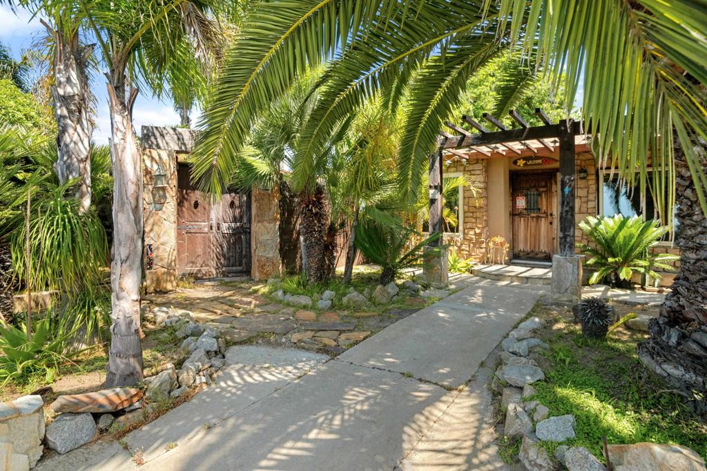 Charming 2 bedroom / 1 bath home with an ocean view on a giant 7,600 sq ft lot located across the street from Goat Hill Golf Course surrounded by lush palm trees giving the property a tropical feel. Small upgrades throughout but keep in consideration that the home is to be sold "As Is." With some TLC, the possibilities are endless. The is 934 sqft of living space inside the home. Close to all shopping, dining, parks, golf, beach and much more! Open house Sat June 28th 12:00-4:00pm and June 29th 12:00-3pm