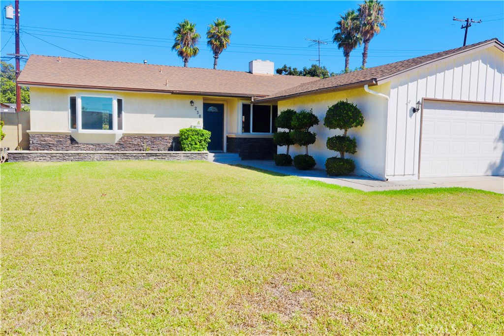 Beautiful single-story home in the city of Anaheim! This home features a spacious living room, dining area, and a kitchen with Corian Countertops, Frigidaire 'Gallery' Series Stove/Oven, Microwave and Dishwasher, Oak Cabinets, Tile Flooring, Pull Out Cabinets, Pantry Shelves, Corner Rotating Shelves for Pots and Pans, Recessed Lighting with Dimmer Switch, and a Greenhouse Window. It offers 3 bedrooms, 1.75 bathrooms, a two-car garage with direct access, a long driveway, fresh paint, and tankless water heater pump. The front yard is beautifully landscaped, and the backyard has plenty of space and is perfect for entertaining. There is plenty of parking on driveway and street parking. Close to great shopping, eateries, and entertainment such as Target, Disneyland, Downtown Disney, and more! Move in ready!