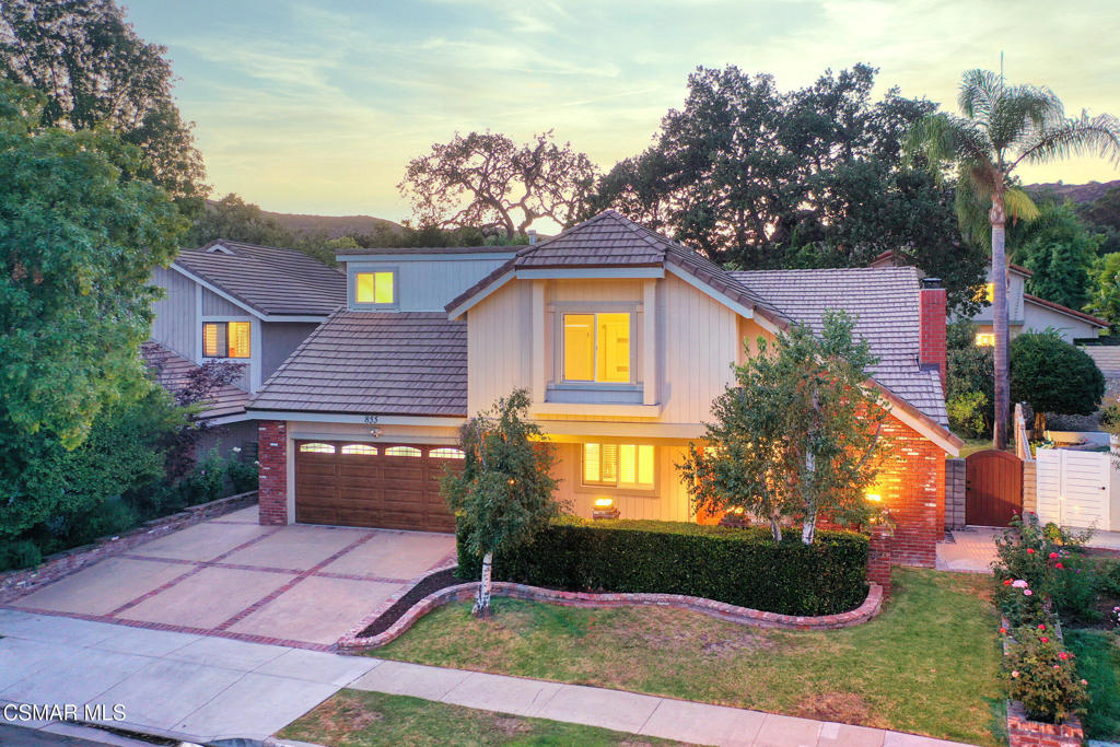 Discover this stunning totallyremodeled four-bedroom, three-bath residence boasting over 2,500 square feet of beautifully reimagined living space in the highly sought-after Village Home community of Westlake Village. Perfectly situated moments from the park, this home blends timeless charm with modern luxury.From the moment you arrive, the curb appeal shines with beautifully designed garage doors, a stylish side gate, and a statement front door leading from a charming brick courtyard--a warm welcome to your private retreat.Inside, you'll find luxury vinyl plank flooring, a custom stonework fireplace, and a designer-carved wood staircase with sleek wire railing that makes a dramatic impression. The chef's kitchen is incredible, featuring five-star stainless steel appliances, a massive island, and custom cabinetry, seamlessly connected to the formal dining area and great room.A spectacular entertainer's bonus room offers endless possibilities and showcases a second custom-painted, hand-carved staircase that ascends to your very own private movie theater. Spacious secondary bedrooms and fully upgraded bathrooms ensure comfort for family and guests alike, while the primary suite serves as a true sanctuary. This suite features artistic details, a spa-inspired shower with four showerheads, custom lighting, and a closet system offering never-ending space.Throughout, gorgeous ceiling fans filter the breeze beneath dramatic ceilings, creating a light, airy ambiance.Step outside to your quiet, private backyard oasis, complete with a sparkling pool, multiple entertaining areas, and lush landscaping--ideal for hosting unforgettable gatherings or enjoying peaceful evenings under the stars.This home is a rare opportunity to own a luxury Village Home that balances elegance, comfort, and function, all in one of Westlake Village's most desirable neighborhoods.