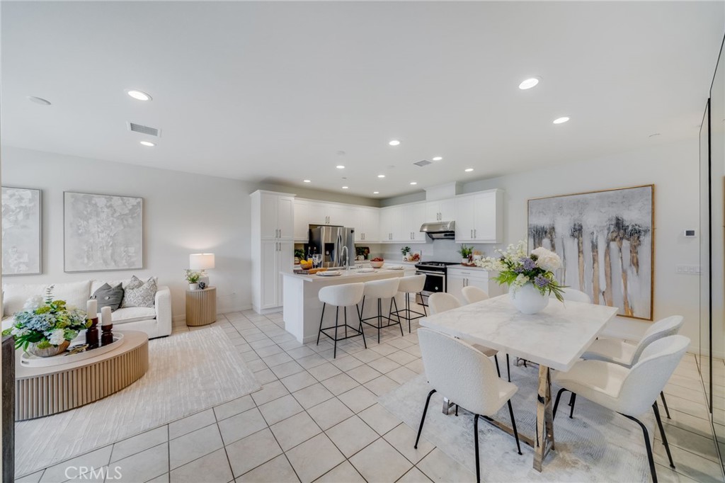 SELLER MOTIVATED!!!Welcome to this exquisite tri-level condo in the prestigious GATED COMMUNITY of Iron Ridge in Portola Hills. This beautiful home boasts 2,322 Sq. Ft of living space, 4 bedrooms, 3.5 baths, 2 car attached garage. On the first floor, you'll be greeted by an open floor plan that seamlessly connects the family room, kitchen, and dining area. The contemporary kitchen boasts white cabinets, a large island with bar-height counter seating, quartz countertops, stainless steel appliances, making it a chef’s dream. The second level offers 3 bedrooms as well as 2 full bathrooms, a laundry room for your added convenience. The primary ensuite boasts double sinks with ample cabinet space, a walk-in shower, and a spacious walk-in closet. The Third level is designed for ultimate comfort and flexibility, with a versatile loft space ideal for a home office, theater, or easily converted into a fifth bedroom. This level also includes a guest bedroom, guest bathroom. Additionally, a large city park just outside the gates offers the perfect setting for evening sunsets, dog walks, or pickleball matches. With the majestic backdrop of Saddleback Mountain and proximity to top-rated schools, such as Portola Hills Elementary, this community provides a serene environment for relaxation, growth, and outdoor recreation. Enjoy the security and
