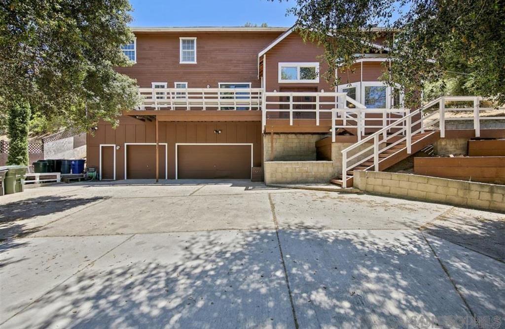 Welcome to your serene mountain escape in the heart of Pine Valley! This 4-bedroom, 3.5-bath custom home offers nearly 2,900 sq ft of versatile living space on a wooded, private lot at approx. 3,700 ft elevation. Rustic charm meets modern comfort with thoughtful upgrades throughout. Enjoy soaring ceilings, new dual-pane sealed windows designed to block heat, new window frames, and a spacious bonus room—perfect for a home office, gym, or game room. Recent exterior improvements include a brand new roof, solar panels, new garage doors, and new fiber cement siding with fresh exterior paint—a rare find in this peaceful mountain community. The kitchen is both functional and spacious, offering ample storage and a wet pantry ideal for entertaining. Inside, you’ll also find new flooring in the living room, stairs, and upstairs. The home features two fireplaces—one wood-burning stove and one traditional fireplace—creating a warm and inviting ambiance throughout. The oversized 3-car garage offers high ceilings and generous space for storage or hobbies. The sloped lot provides privacy and scenic forest views from every angle. Whether you're looking for a full-time residence or a weekend getaway, this one-of-a-kind property offers the perfect blend of comfort, charm, and lifestyle in Pine Valley. Discover the peaceful beauty of mountain living at 8141 Pine Blvd in the charming community of Pine Valley. Nestled at approximately 3,700 feet elevation, this spacious 4-bedroom, 3.5-bath custom home offers nearly 2,900 sq ft of thoughtfully designed living space on a private, wooded lot with scenic views, mature trees, and a serene natural backdrop. This one-of-a-kind property blends rustic charm with smart, modern upgrades—making it ideal as a full-time residence or tranquil weekend escape. Inside, you'll find soaring ceilings and new dual-pane sealed windows designed to block heat and improve efficiency, along with all new window frames. A spacious bonus room provides the flexibility to function as a home office, gym, playroom, or guest space. Recent exterior upgrades add tremendous value and curb appeal, including: • Brand new roof • Solar panels • New fiber cement siding • Fresh exterior paint • New garage doors Inside, the kitchen is both functional and spacious—perfect for cooking, entertaining, or everyday use. It features ample cabinet storage and a wet pantry for convenience and prep space. Recent interior upgrades include new flooring in the living room, on the stairs, and throughout the upstairs living area. The home offers two fireplaces—a cozy wood-burning stove in one living space and a traditional fireplace in another—providing warmth and ambiance during Pine Valley’s cooler seasons. The layout includes a total of 4 bedrooms and 3.5 bathrooms, offering plenty of space for family, guests, or multi-generational living. The oversized 3-car garage is ideal for those needing extra room for hobbies, vehicles, workshop space, or storage. The garage features high ceilings and direct access to the home, making it both practical and secure. Situated on a sloped lot, the home enjoys a heightened sense of privacy and stunning forest views from multiple vantage points. There is ample opportunity to create outdoor living areas, garden spaces, or enjoy the peaceful surroundings just as they are. Pine Valley is a close-knit community surrounded by the Cleveland National Forest, offering access to hiking trails, nature walks, horseback riding, and seasonal weather with a touch of snow in the winter months. Just under an hour from downtown San Diego, you can enjoy the best of both worlds—quiet mountain life with access to coastal amenities. This home is a rare opportunity to own a move-in ready property in one of East County’s most sought-after rural settings. With modern improvements already completed and timeless mountain character throughout, 8141 Pine Blvd is ready to welcome its next owner home.