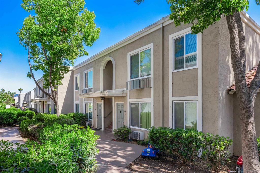 **Enjoy living in this gated community with detached 1 car garage PLUS an additional covered carport parking space, and ample guest parking! The most recent model match sold for $420k in April. This condo is an excellent value!!** Welcome to this light and bright 2-bedroom, 1.5-bath upper unit, freshly updated with new flooring, modern light fixtures, and fresh paint throughout. Nestled in the secure, gated Villa La Paz community, this home offers comfort, convenience, and a park-like setting. Enjoy the ease of access with this unit’s prime location near the vehicle gate—and a unique bonus: control the gate remotely right from the primary bedroom, making it easy to welcome visitors and guests. The spacious layout offers a functional living space, while community laundry and pool facilities are just a short distance away. Villa La Paz features expansive greenspaces with BBQ areas, perfect for relaxing or entertaining outdoors. Parking is a breeze with a designated one car detached garage, an assigned covered carport space, plus several additional guest parking spots close by! Don't miss this opportunity to own in a peaceful, amenity-rich community with convenience at your doorstep!