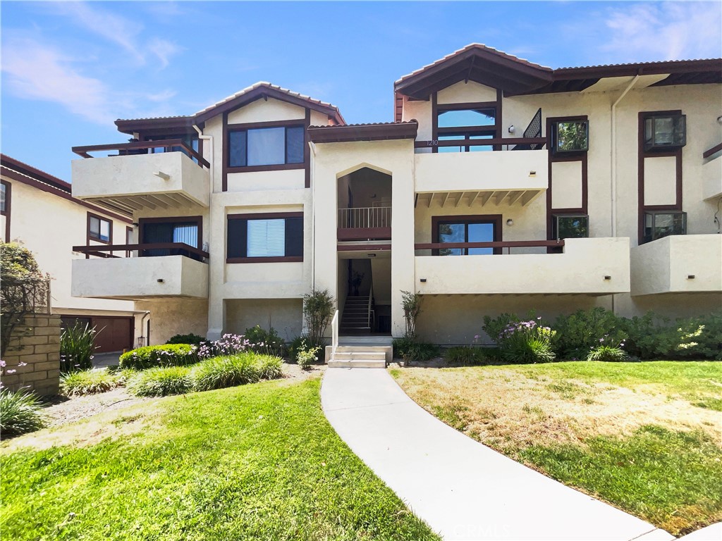 Welcome to your turnkey condo nestled in the heart of Canyon Country’s highly sought-after Canyon Oaks community. This beautifully maintained upper-level unit is filled with natural light and features vaulted ceilings, a private balcony, and an open-concept layout perfect for both everyday living and entertaining. The spacious living area flows into a dining space and updated kitchen with modern appliances and ample cabinetry, while two generous bedrooms—including a primary suite with an ensuite bath and mirrored closet doors—offer comfort and privacy. Residents enjoy resort-style HOA amenities including multiple swimming pools and spas, playgrounds, picnic areas with BBQ grills, and serene walking paths surrounded by well-kept greenbelts. Additional perks central air and heat, a private two-car tandem garage, and guest parking. Located within the highly rated William S. Hart Union High School District, and zoned for Canyon High School, this home offers access to excellent public education. You'll also be just minutes from popular retail spots like Costco and Target, local parks, hiking trails, and with quick access to the 14 Freeway, making this home a perfect balance of comfort, convenience, and community.