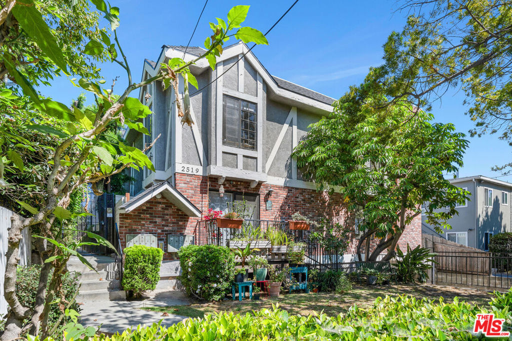 CHARMING TWO-STORY TOWNHOUSE IN PRIME SANTA MONICA. Nestled on a quiet, tree-lined street in one of Santa Monica's most desirable neighborhoods, this beautifully maintained two-story townhouse offers the perfect blend of comfort, space, and coastal charm just minutes from world-famous beaches, top dining, shopping, and entertainment. The spacious main level features an inviting living room with a cozy fireplace and private balcony, a thoughtfully designed kitchen with ample cabinetry, generous counter space, and a convenient pass-through bar, plus a sunny dining area that opens to a small enclosed patio ideal for indoor-outdoor living. A powder room and large hallway closet with custom built-ins add functionality. Upstairs, the light-filled primary suite boasts a walk-in closet, dual vanity, and private bath. The second bedroom includes its own walk-in and mirrored closets, with a separate full guest bathroom nearby. A tucked-away laundry area with decorative folding doors and multiple skylights throughout completes the home's bright, airy feel. Set within a contemporary, landscaped complex, this home is moments from Whole Foods, Trader Joe's, schools, public transit, and the Water Garden Office Park. A rare opportunity to enjoy everyday convenience and timeless Santa Monica living.