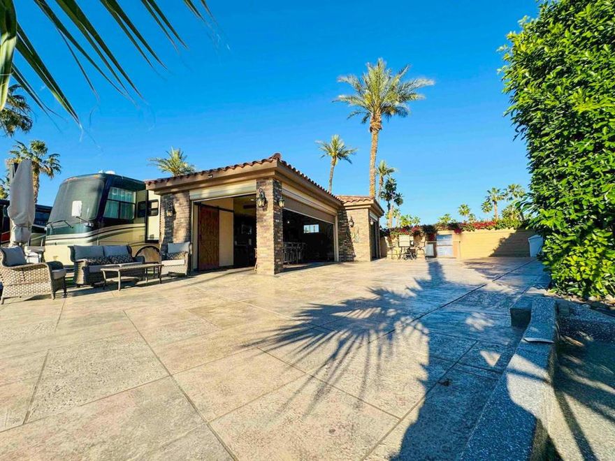 Experience the perfect blend of outdoor living and indoor comfort on this exceptional luxury RV lot featuring a fully furnished, 600 sq. ft. Casita. Enjoy breathtaking sunsets and mountain views from your private retreat, enhanced by three fully automatic wall screens that seamlessly blend indoor and outdoor spaces. The spacious driveway, finished with a two-tone epoxy overlay and resealed curbs, offers ample room for a 45-foot RV, a vehicle, and a golf cart. A plumbed water softener for your coach adds convenience, while the turnkey furnishings, including patio furniture, dishware, and glasses, ensure a move-in-ready experience.The beautifully designed Casita includes custom cabinetry, a stainless steel fridge, dishwasher, stove/oven, garbage disposal, and granite counters, with an 8-foot island and four new upholstered stools at its heart. The living area features a leather sectional sofa, a full-wall brick fireplace, a 65' mounted TV with a Samsung soundbar, two ceiling fans, and recessed LED lighting throughout. Climate control is provided by a Lennox Mini-Split HVAC unit. Situated on an oversized, pie-shaped lot, the property includes a Lynx Sedona BBQ area with granite countertops, a dog run, and extra storage space. This Casita also offers an excellent short-term rental opportunity, currently generating premium income and rented until the end of March. Whether as your personal sanctuary or a high-income rental property, this lot delivers unparalleled luxury and functionality.&#8205;Outdoor Resort Indio is a Class A only RV resort in Indio, CA.