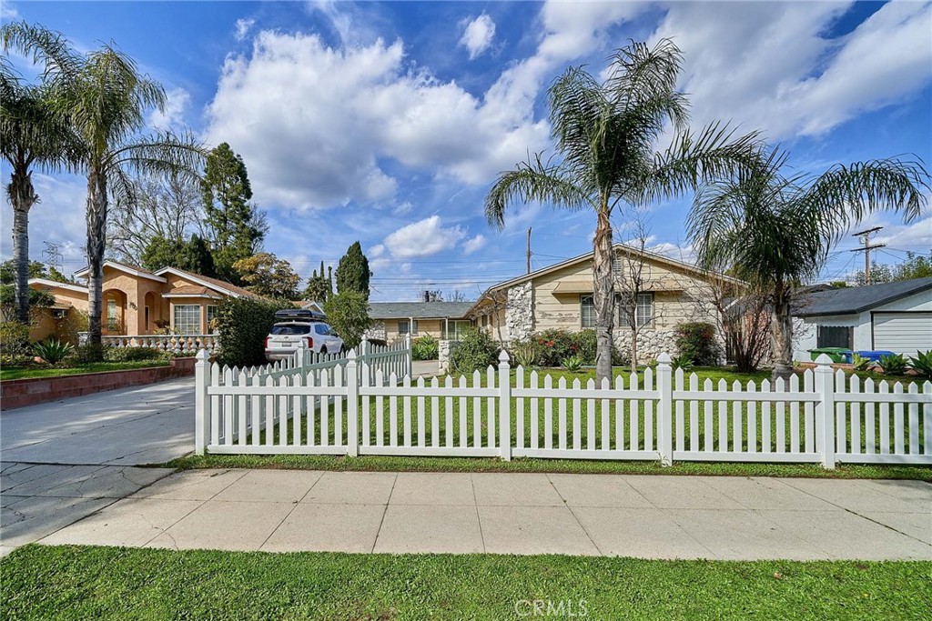 This beautifully remodeled single-family home is located in a desirable family-oriented neighborhood and features a lovely swimming pool. It belongs to the highly acclaimed Granada Hills Charter School district. The open floor plan, double-pane windows throughout, and bright atmosphere are notable features. With spacious rooms including 4 bedrooms and 2 bathrooms, a large living area, and a cozy dining space, it offers comfortable living. There's an attached garage but no direct access, a driveway, and a backyard with beautiful fruit trees and a swimming pool, providing a peaceful yet dynamic ambiance. Conveniently situated close to freeways, churches, stores, schools, shopping centers, and restaurants.