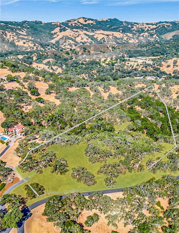 PRICE REDUCED! Exceptional building lot in West Atascadero offering panoramic views and last available lot along Alta Pradera Ln a premium neighborhood of North San Luis Obispo County! Located just a few minutes to downtown and freeway access, this location offers a paved road right to the property line! City water, natural gas, cable and telephone also right to the site! The proposed building envelop offers amazing vistas as far as the eyes can see! Come build your dream home among dozens of majestic oaks, magnificent rock cropping and premium corner location of over 6 acres on the West side. If you're looking for one of the best parcels in the North County for privacy and views this is it! Please note: Private Road, must be accompanied by an agent.