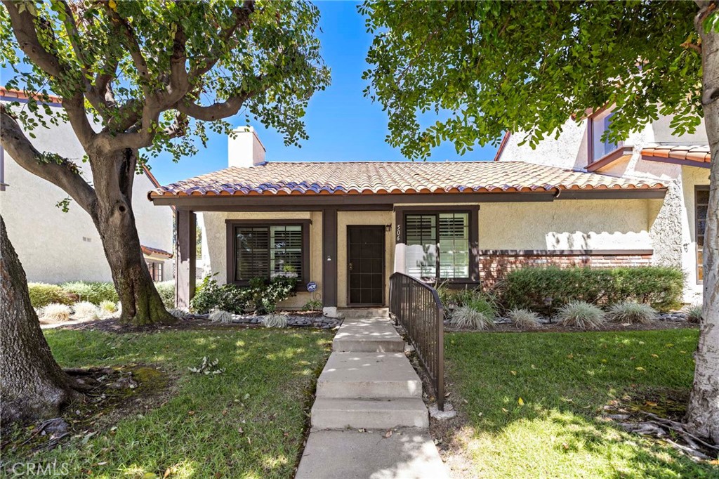 Rare Single-Story End unit in the Highly Desirable La Cuesta Encantada Community. This unit faces San Dimas Ave, allowing for easy access and ample street parking. Walk Right into the Open Living space of your Living room with a Nice Brick Gas Fireplace and Laminate wood flooring. Vaulted Ceilings open up the Dining area, which leads into the updated kitchen. Both Bedrooms are a good size and with plenty of closet space and Private bathrooms. The primary bedroom has a sliding door with access to private back patio, where you will find the detached 2 car attached garage with Laundry area. Upgrades to this home are: Kitchen with Granite Counter Tops,Tankless water heater, Custom dual pane windows, newer heater/ac unit, plantation Shutters, new carpet in primary. This Home is close to just about everything - Downtown San Dimas, Shopping, Bonelli Park, Raging Waters, FWYs