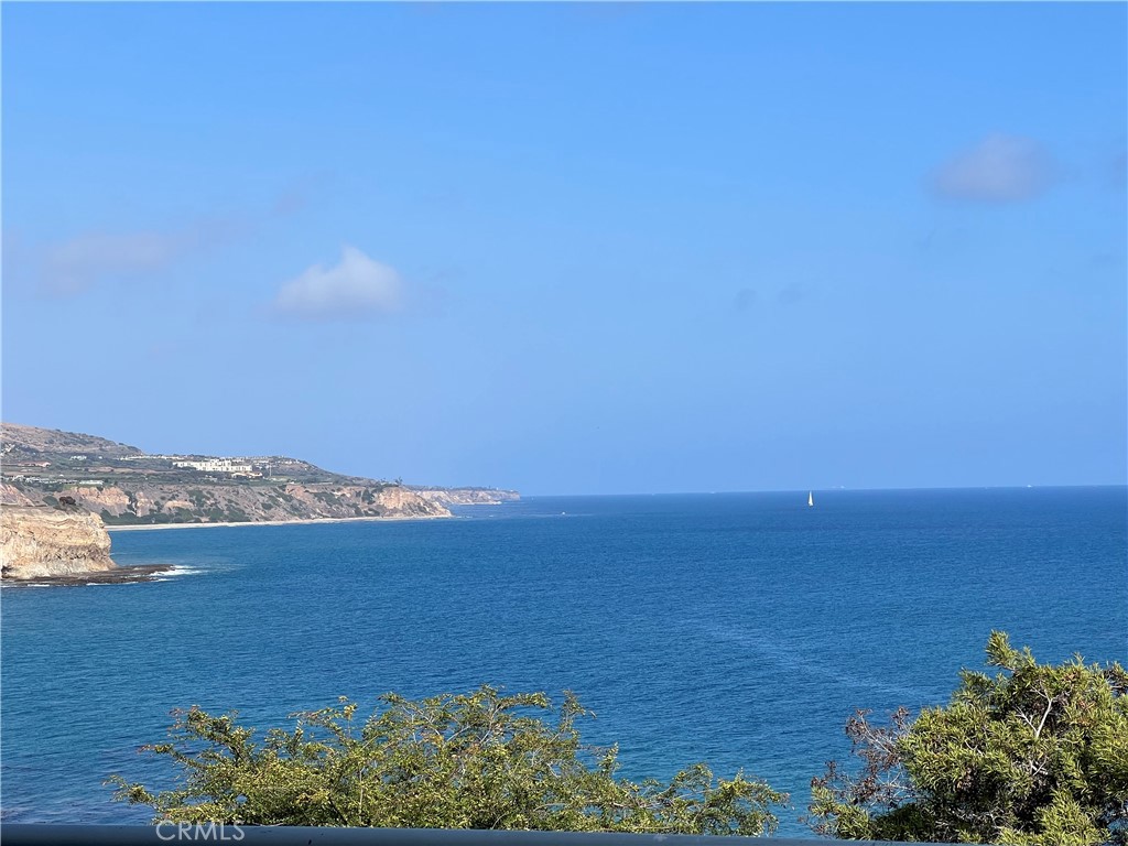 Welcome to the sought after Bay Club, located near the bluffs of Palos Verdes. This top floor penthouse boasts ocean views from all major rooms, an open concept layout, with a generous 1565 sq.ft. area to make your own. Step outside on the balcony to view rolling hillsides as well as the majestic Pacific Ocean. There is an abundance of beauty everywhere you look. Enclosed parking provided for 2 cars, which includes 2 storage units, just steps away from the entrance to the lobby and elevator. Outside, the grounds offer a serene setting of gentle paths, places to gather, and meander. As an added bonus, the Bay Club offers many amenities to enjoy including tennis, 2 pools, spa, gym, exercise room, clubhouse with full kitchen, sports court, and shuffleboard. Take a stroll down the gated private path to the beach, surrounded by the majestic cliffs, with Catalina in the distance. A short walk along the bluffs takes you directly to the popular, nearby Terranea. Enjoy the convenience of several popular restaurants, shops, people watching, even a round of golf. This is truly a special place to live. Come see why.