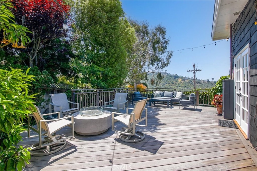 Soak up the sun and sea breeze in this charming, fully furnished Laguna Beach home, available exclusively for the month of July. Tucked into one of the most loved coastal neighborhoods, this cozy 3-bedroom, 1-bathroom beach house is the perfect summer retreat for anyone looking to unplug and unwind. Inside, the home feels bright and breezy, with plenty of natural light, soft beachy tones, and everything you need for a comfortable, relaxed stay. The living room invites you to kick back after a day in the surf, while the fully stocked kitchen makes meals at home a breeze. Each of the three bedrooms is thoughtfully furnished with comfort in mind, and the single bathroom is clean and simple with a classic coastal feel. Outside, there’s plenty of space whether you’re catching the ocean breeze or listening to the quiet hum of a summer night. This is an easy, down-to-earth home for anyone who loves the feeling of a true beach summer.