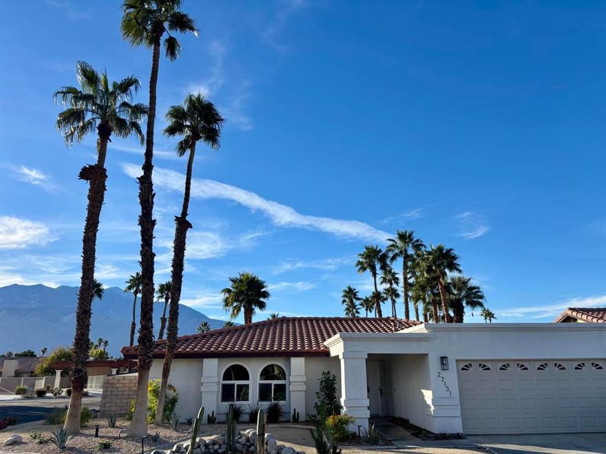 This lovely, updated 3 bedroom, 2 bath home sits on a prime corner lot within the exclusive gated community of Shadow Crest. Step through the double doors into foyer with the guest bedroom entrance to the left and then direct through the archway to find the well designed open floor plan. There is a built in dry bar to the right that leads into the kitchen. The kitchen is open to the dining and living room areas. It features a nice breakfast bar and stainless appliances. Down the hallway you will find a second guest bedroom, guest bath and to the right is the primary bedroom with a large walk in closet and second bath. A few of the upgrades include ceramic tile and pergo flooring, recessed lights, ceiling fans, sliding glass doors and the homes interior has been freshly painted. Did I mention the Solar Panels? Yes, they are on the property and will offer great savings;.there will be a cap for the usage. There is a pantry and utility room off of the kitchen and a door that leads into the garage. The garage is converted into a casita which has unlimited possibilities. The rear yard is lush and features the most magnificent views of the San Jacinto Mountain Range. The community pool/jacuzzi, guest parking and tennis courts are a short walk located in the cul-de-sac directly behind the home. Convenient to all the desert has to offer, including golf courses, shopping restaurants and entertainment.