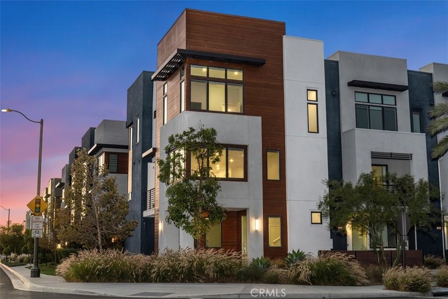 MODERN LUXURY WITH PANORAMIC VIEWS — Welcome to this beautifully designed corner home in the heart of Tustin Legacy, offering over 2,200 SQFT of open living space and some of the best park and mountain views in the community. With only one shared wall and abundant natural light throughout, this residence feels both private and spacious.



The versatile floor plan includes 4 bedrooms and 3.5 baths, highlighted by a first-floor bedroom with an en-suite bath—ideal for guests, in-laws, or a dedicated home office. The main level features an expansive great room with soaring windows and a chef’s kitchen complete with quartz countertops, stainless-steel smart appliances, a large center island, and a covered balcony perfectly framing the park and hangar views.



Upstairs, the primary suite is a true retreat with oversized windows capturing sweeping vistas, plus a spa-inspired bath and generous walk-in closet. Two additional bedrooms complete the top floor, each designed with comfort and style.



Located in the desirable Levity Community, residents enjoy access to resort-style amenities including a sparkling pool, spa, and BBQ area. Just steps from Victory Park, The District at Tustin, top-rated schools, and minutes from freeways, this home blends luxury living with everyday convenience.