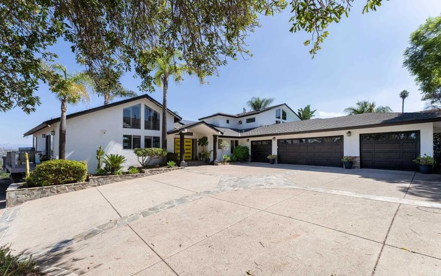 Absolute STUNNER in Mount Helix / Horizon Hills! This private contemporary California-style home is gorgeous inside and out, showcasing 180-degree panoramic views. Modern finishes throughout, including stainless steel appliances, stone counters, travertine & luxury vinyl flooring, custom light fixtures, vaulted ceilings, multiple skylights, and two gas fireplaces. The entire second floor primary suite is the perfect retreat, with floor to ceiling windows and private balcony overlooking pool and amazing mountain views. Massive spa-like ensuite bathroom with a huge custom walk-in closet, a secondary closet, tons of storage and its own HVAC. An attached large studio/granny flat/ADU (currently renting for $1500/mo.) includes a private exterior entry, kitchen, bathroom and walk-in closet. This beautiful, gated estate, just shy of an acre, is a fully fenced corner lot with spacious artificial grass area, koi pond, multiple decks, outdoor kitchen, fruit trees, RV parking, and a large in ground heated pool with waterfalls. In addition, there is an oversized attached 4-car garage, 40 solar panels and dual zoned main floor HVAC.