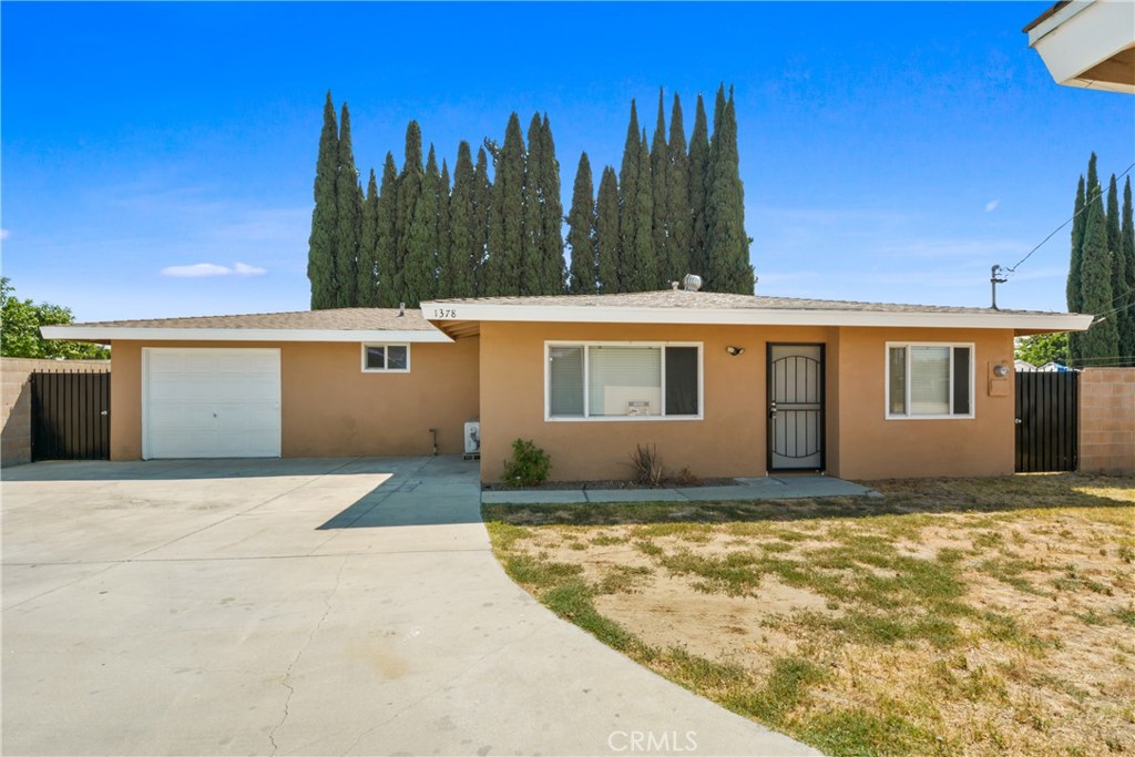 Welcome to 1378 S Gibbs St, a fully remodeled 3-bedroom, 2-bath standalone home located in a quiet and convenient Pomona neighborhood. This home sits at the back of a shared lot with seven total units, but is completely detached with no shared walls, offering enhanced privacy and space. It features its own private 1-car garage, stackable washer/dryer hook-ups, and ample parking with two additional spaces. Inside, enjoy a brand-new kitchen with updated cabinets, countertops, and backsplash, laminate flooring in the bedrooms, and tile throughout the rest of the home-no carpet anywhere. A new mini-split system provides efficient heating and cooling year-round. Outdoor areas include a small front yard and a large private backyard, ideal for entertaining, relaxing, or gardening. Please note: all other six units on the lot are fully occupied, making this standalone unit a rare and private rental option. Conveniently located near Western University, Pomona Valley Hospital, Bonelli Park, Cal Poly Pomona, and major freeways including the 10, 57, and 71, this move-in-ready home offers modern upgrades, comfort, and an excellent location. Tenant must carry renter’s insurance up to $500,000 coverage with any valid insurance provider and provide proof to management prior to move-in. Strict no smoking policy. No HOA/CC&R's. Tenant is responsible to upkeep backyard and front yard landscaping of their unit. Tenant responsible to pay all Utilities: Electricity, Gas, Trash, Water and Sewer, along with providing proof of utility services to management upon move-in. Tenant is responsible to pay for Internet and Cable, if services are desired. Tenants must provide total move-in costs along with proof of Utility confirmations for future move-in date within 24 hours of application approval.