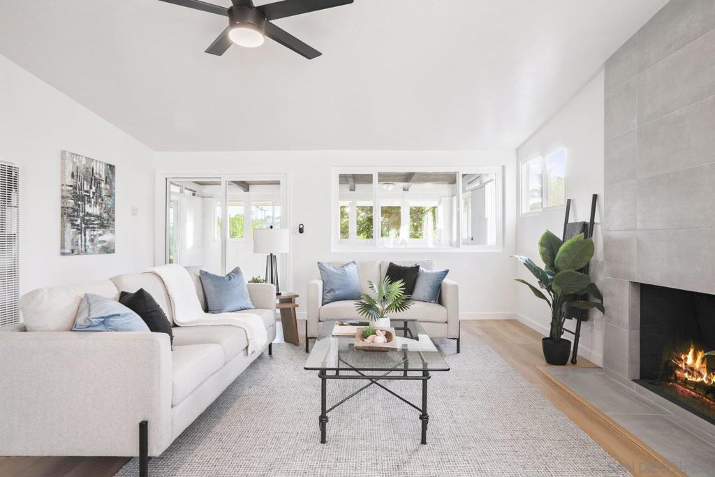 Turnkey Serra Mesa Beauty – Freshly Renovated, Stylish, and Ready to Impress! Discover 3216 Towser St, a thoughtfully upgraded 3-bedroom, 2-bath home offering 1,084 sq. ft. of interior living space plus a fully enclosed 225 sq. ft. sunroom—bringing the total to 1,309 sq. ft. of comfort and flexibility. Nestled on a quiet and safe street, this home pairs modern upgrades with a bright, welcoming layout, making it one of the best values in Serra Mesa. Step inside to find brand-new dual-pane windows and doors, luxury vinyl plank flooring, and fresh interior paint throughout. Vaulted ceilings in the bedrooms add to the spacious feel, while both bathrooms showcase stylish, designer-inspired finishes. The custom kitchen is a true highlight—complete with quartz countertops, a designer tile backsplash, stainless steel appliances, and ample cabinetry for storage and organization. Relax or entertain in your private backyard retreat featuring a covered patio, mature landscaping, and added privacy with no rear neighbors thanks to the open easement behind the property. Perfectly positioned near top-rated schools, shopping, dining, and convenient freeway access, this move-in-ready home offers modern comfort and effortless living in a prime central San Diego location. Don’t miss your chance to own this beautifully renovated Serra Mesa gem—schedule your showing today!
