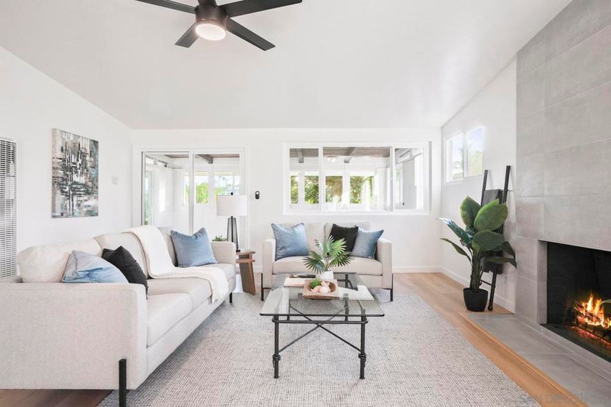 Turnkey Serra Mesa Beauty – Freshly Renovated, Stylish, and Ready to Impress!  Discover 3216 Towser St, a thoughtfully upgraded 3-bedroom, 2-bath home offering 1,084 sq. ft. of interior living space plus a fully enclosed 225 sq. ft. sunroom—bringing the total to 1,309 sq. ft. of comfort and flexibility. Nestled on a quiet and safe street, this home pairs modern upgrades with a bright, welcoming layout, making it one of the best values in Serra Mesa.  Step inside to find brand-new dual-pane windows and doors, luxury vinyl plank flooring, and fresh interior paint throughout. Vaulted ceilings in the bedrooms add to the spacious feel, while both bathrooms showcase stylish, designer-inspired finishes.  The custom kitchen is a true highlight—complete with quartz countertops, a designer tile backsplash, stainless steel appliances, and ample cabinetry for storage and organization.  Relax or entertain in your private backyard retreat featuring a covered patio, mature landscaping, and added privacy with no rear neighbors thanks to the open easement behind the property.  Perfectly positioned near top-rated schools, shopping, dining, and convenient freeway access, this move-in-ready home offers modern comfort and effortless living in a prime central San Diego location.  Don’t miss your chance to own this beautifully renovated Serra Mesa gem—schedule your showing today!