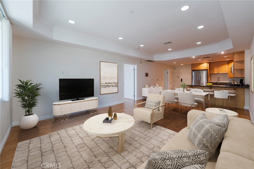 Stunning Luxury Condo in Prime Koreatown Location! AMERICAN DREAM LENDER QUALIFICATION - Deferred Assistance $12,500 and Lender Credit $5,000! Ask Listing Agent for more information! Nestled in the heart of vibrant Koreatown, this beautifully designed 1-bedroom, 1-bathroom luxury condo offers an exceptional blend of style, convenience, and modern amenities. Built in 2008, this immaculate residence boasts high-end finishes and thoughtful details throughout, making it the perfect retreat for urban living. Step inside to discover an open-concept layout with bamboo hardwood floors in the living area, creating a warm, inviting atmosphere. The chef-inspired kitchen is equipped with sleek LG stainless steel appliances, granite countertops, and custom Canadian maple wood cabinetry—perfect for both cooking and entertaining. The spacious bedroom features a walk-in closet that connects seamlessly to the elegantly appointed bathroom, showcasing luxurious marble flooring and modern fixtures. Tall 9-foot ceilings and crown molding add an extra layer of sophistication, creating a sense of openness and light. Enjoy the outdoors on your private large patio, ideal for relaxing or dining al fresco. The unit also includes LG washer and dryer and plenty of storage space throughout. The complex offers low HOA fees (same rate since 2015) and a tranquil courtyard with a fountain and BBQ area, perfect for social gatherings or unwinding after a busy day. Low HOA covers utilities - water, sewer, trash, and gas! You only have to pay electricity and internet! Comes also with secure gated parking garage with 2 assigned tandem parking spots on the lower ground level. Centrally located, you’ll have easy access to Downtown LA, Koreatown, West LA, major freeways, and a wide selection of dining, shopping, and entertainment options—all just moments away! Don't miss this rare opportunity to own a piece of luxury in one of LA's most sought-after neighborhoods!