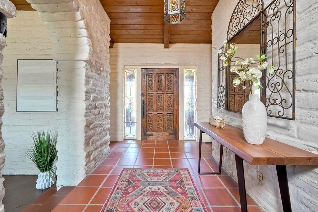 **** Seller will entertain offers between $1,779,888 - $1,849,888. **** Old California Charm Meets Modern Comfort in the Heart of Fallbrook Welcome to 3149 Old Post Rd, a rare opportunity to own a piece of Southern California’s architectural history. Built by the legendary Weir Brothers, this timeless adobe estate blends classic craftsmanship with the ease of single-level living, all tucked away on a serene 2.34-acre lot. With over 4,300 sq ft of living space, this thoughtfully designed home features 4 spacious bedrooms, a private office, and a bonus/playroom that easily transforms into extra bedrooms or creative spaces. Multiple fireplaces, large windows, and warm natural textures give the home a cozy yet elevated vibe that’s perfect for relaxed living or unforgettable entertaining. Step outside and you’ll feel like you’ve entered your own private retreat—complete with a sparkling pool, separate guest house, and lush, mature gardens. Whether you're hosting gatherings under the stars or enjoying peaceful mornings with coffee in hand, this home offers the space and privacy to live fully. Additional highlights: ? R-1 zoning for added flexibility ?? 4-car garage with plenty of room for toys and tools ?? Minutes to Bonsall Elementary, local shops, and restaurants Historic. Peaceful. Irreplaceable. This is more than a home—it’s a lifestyle rooted in craftsmanship, space, and timeless beauty. Come experience what Fallbrook living is all about.