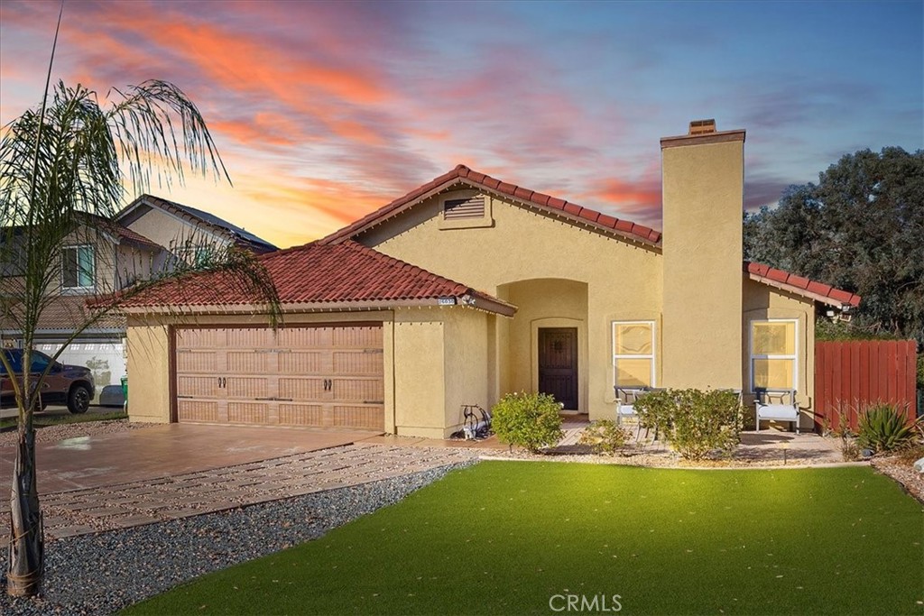 Welcome to this BEAUTIFUL 3-Bedroom, 2-Bathroom SINGLE STORY, Cul-De-Sac home offering 1,354 sq. ft. of living space on a 5,663 sq. ft. lot. This home has been thoughtfully upgraded and sits at the end of a cul-de-sac with no neighbors on the right side. LOW TAX and NO HOA! When you pull up to the home you notice the BEAUTIFUL Barn Style Garage Door, paved driveway, large front patio area with artificial grass, drought resistant plants, fresh exterior paint and RV PARKING. The front door is Solid, Rustic Mahogany with a speakeasy and timeless appeal. When you enter, the home opens to Vaulted ceilings in the Living Room and lots of natural light. New windows were installed and help keep the home energy efficient. SOLAR was recently installed so the AC can be cranked up! The entry, family room, dining room, kitchen, and hallways feature ceramic tile flooring that looks like wood. The bedrooms and bathrooms have oak wood flooring for added warmth. The heart of the home is the Kitchen with New White Quartz Countertops, trendy backsplash and stainless steel appliances. On one side of the kitchen is an informal dining area and on the other side is the formal dining room with a fireplace and decorative wood inlay walls. Perfect for entertaining, the Backyard is a private retreat, with hardscape, two gazebos for chillaxing, artificial grass, and a built-in fire pit with seating. There are citrus trees and a lush grapevine that extends along the back fence. All Bedrooms and Bathrooms have new paneled doors. Both bathrooms have been fully renovated with tiled showers, new toilets, sinks, and modern lighting. The Primary Bedroom faces the backyard, has a good size walk-in closet, and an ensuite Bathroom. The 2-Car Garage has been drywalled and the ceiling was insulated for added comfort and function. Located in an excellent school district, the home is also conveniently located near shops, supermarkets, great restaurants, and the 215 and 15 Freeways. It is easy to get around town and to commute for work. The Temecula Wine Country is 15 minutes away! Come see this incredible opportunity to live in the heart of Murrieta.