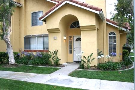 Fantastic TWO STORY END UNIT townhome with NO ONE ABOVE OR BELOW, with high ceiling, very bright with windows from three sides, great airflow from all four sides and an open floor plan. New faucets in the kitchen and bathrooms with granite countertops; they were both updated a few years ago, Travertine tiles on the entire first floor and carpet in the bedrooms. One bedroom is on the first floor if you wish not to deal with stairs and the other two bedrooms are on the second floor for more privacy. There is also a patio for your outside seating while barbequing your meal. This property is in the very desirable area of Westpark with one car garage attached and one carport and one unassigned parking space with permit for your third car. It is also in a fantastic highly rated schools of Irvine district and it is close to shopping centers with close access to both highways 405 and 5 with no traffic noise.