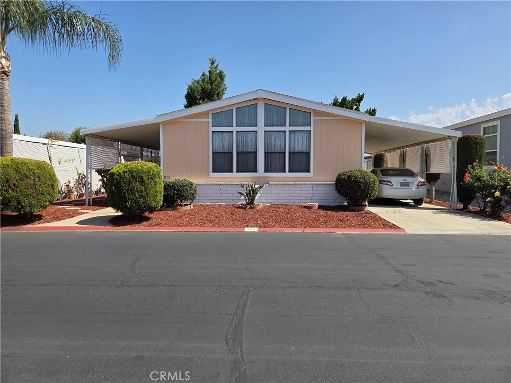 Beautiful 2-bedroom 2 bath mobile home located in the exclusive Rancho Ontario. This home offers new landscaping throughout lot, new LED lighting, recently exterior painted, new flooring in kitchen, laundry room and bathrooms and also offers a shed. Renovated amenities await you offering a heated pool and spa opened year-round, a hall to host any event, our clubhouse offers a billiards room, card table room, a fitness room as well as a gym or lounge area to just sit and relax. The Park also offers an active area with two pickleball courts, bocce ball and we didn't forget about your fur babies, two dog parks. Don't miss out on touring and calling it home.