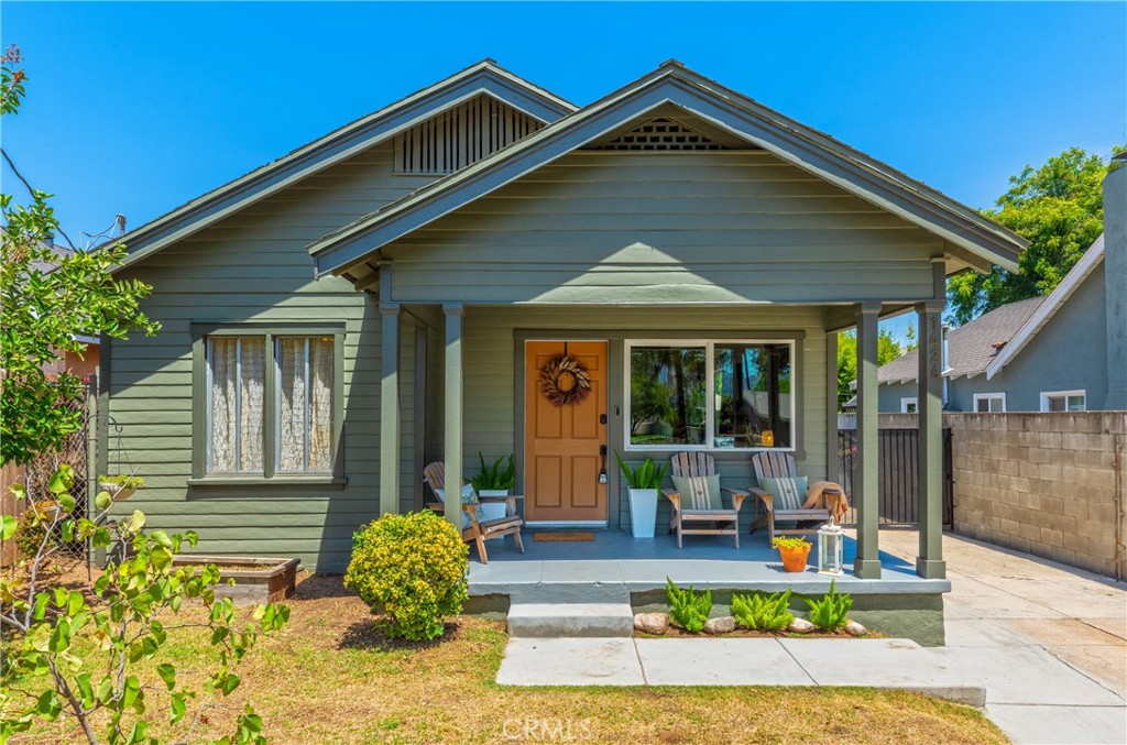 Step into this delightful Craftsman bungalow, where classic charm meets modern comfort. The spacious living room welcomes you with a Batchelder fireplace, setting a cozy ambiance. The open-concept kitchen features a stove, dishwasher, and refrigerator, along with convenient washer/dryer hookups and a dedicated dining area. The primary bedroom offers a peaceful retreat with ample closet space, while the bathroom exudes vintage charm with its classic clawfoot tub and dual-sink vanity. A second bedroom is located at the front of the house. Throughout the home, you'll find engineered wood flooring and enjoy year-round comfort with central air and heat. The entire interior and exterior have been freshly painted, ensuring a move-in-ready experience. Outside, the property boasts a deck, perfect for outdoor dining and lounging. A grassy area offers ample space for outdoor activities, complemented by a convenient storage shed. Additionally, a long driveway provides generous off-street parking. **Seller will entertain a lease with an option to buy.**