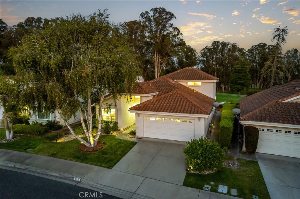 Panoramic Fairway Views & Coastal Serenity! Enjoy sweeping views of the fairways and embrace the laid-back coastal lifestyle in this beautifully appointed 3-bedroom, 3-bath home. The spacious primary suite is conveniently located on the main floor with direct access to a covered patio and a recently remodeled bath featuring a contemporary walk-in shower. Upstairs, an oversized bedroom/flex space opens to a generous 10' by 16' balcony—perfect for soaking in the breathtaking scenery. Inside, vaulted ceilings and a refreshing open floorplan create an airy, inviting atmosphere. Newer carpet adds comfort throughout. A bright kitchen with breakfast nook and built-in buffet makes breakfast a breeze. Step outside to a large patio surrounded by low-maintenance landscaping, offering endless opportunities for relaxation and gatherings. An extended 6' by 24' garage provides ample space for your golf cart. Whether you're sipping coffee at sunrise or hosting sunset get-togethers, this coastal haven delivers the lifestyle you've been dreaming of.